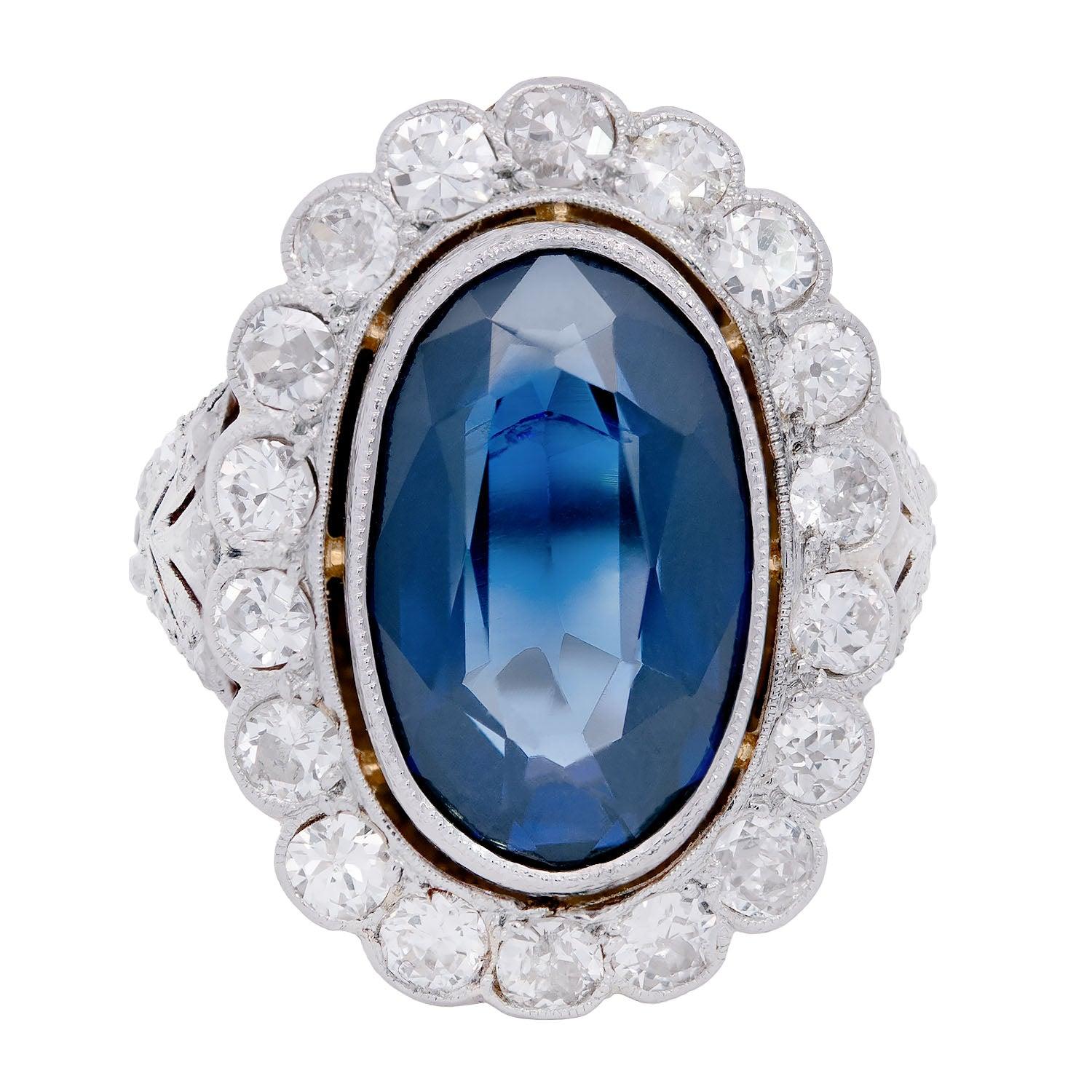 A breathtaking sapphire and diamond ring from the Edwardian (ca1910) era! This gorgeous ring features an estimated 7.50ctw sapphire at the center of a beautiful platinum and diamond mounting within a milgrained bezel. Surrounding the sapphire is a