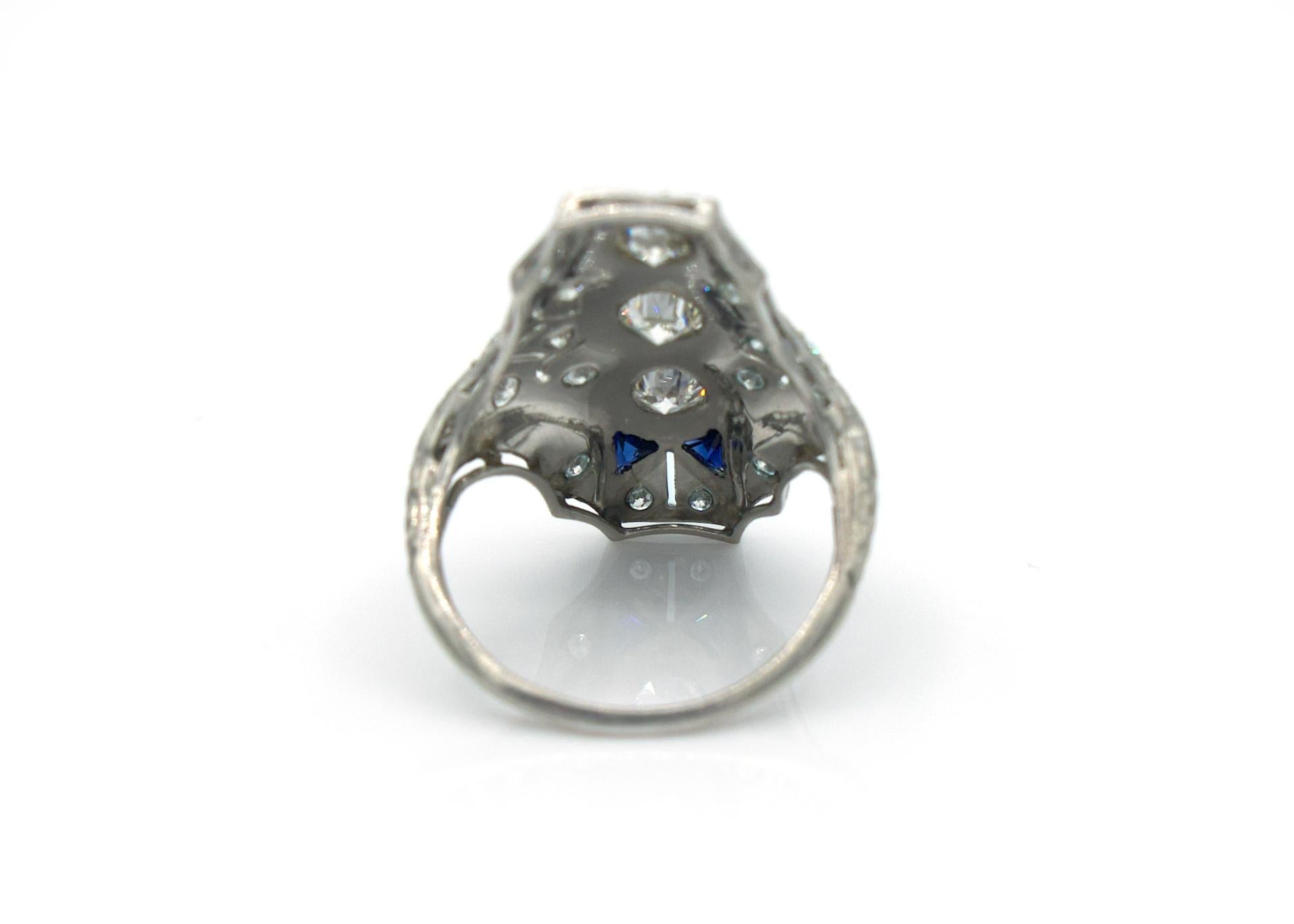 Antique Cushion Cut Edwardian Platinum 3 Stone Diamond and Sapphire North South Ring For Sale