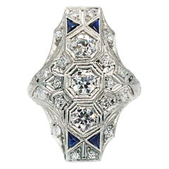 Edwardian Platinum 3 Stone Diamond and Sapphire North South Ring