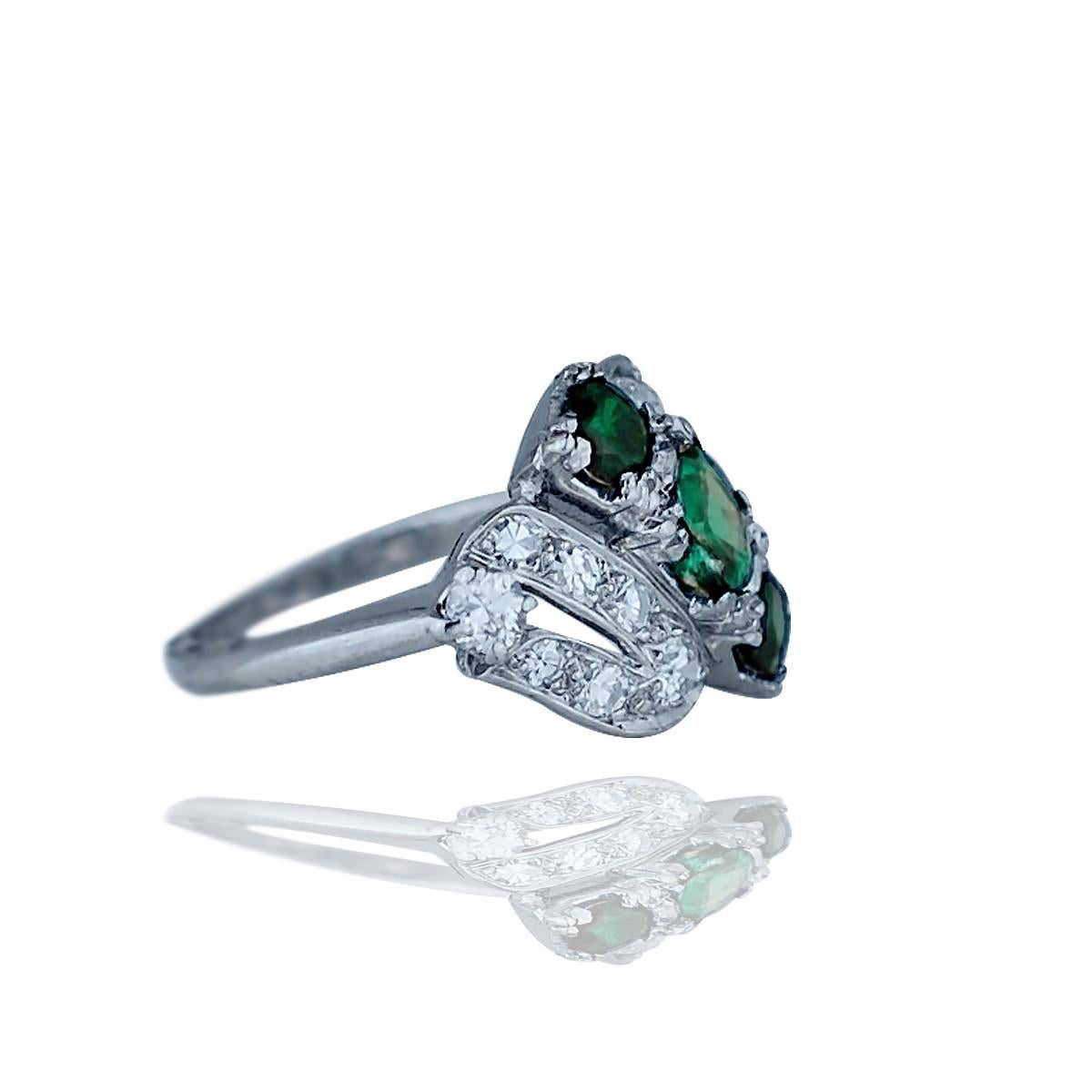 Retro Platinum .50 Ct. Diamond, 3 Green Stone 
The setting is set with (16) round single cut diamonds graduating from 2.0-3.2 mm in diameter. The total weight of diamonds is estimated .50 carat. 
Quality is SI1 clarity and G color, Size 6 and weight