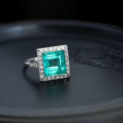 Edwardian Platinum 6.50 Carat Step-Cut Colombian Emerald 0.40cts Diamond Ring