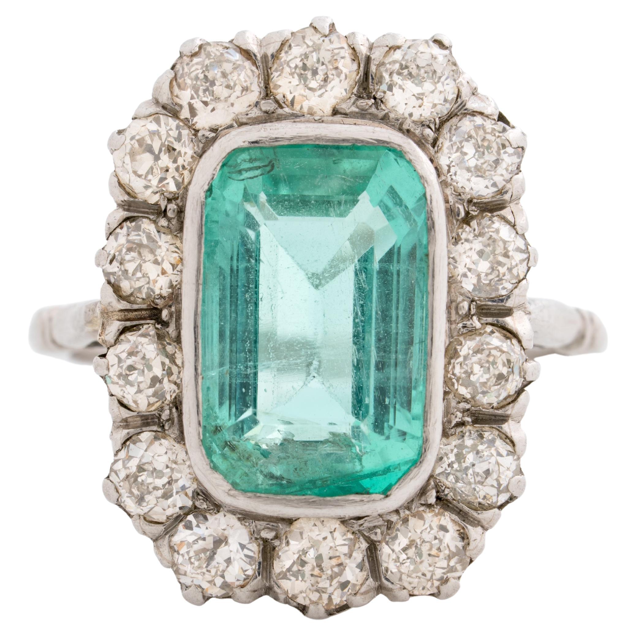 Edwardian Platinum and 4.5 Carat Colombian Emerald Ring and Diamond Ring For Sale