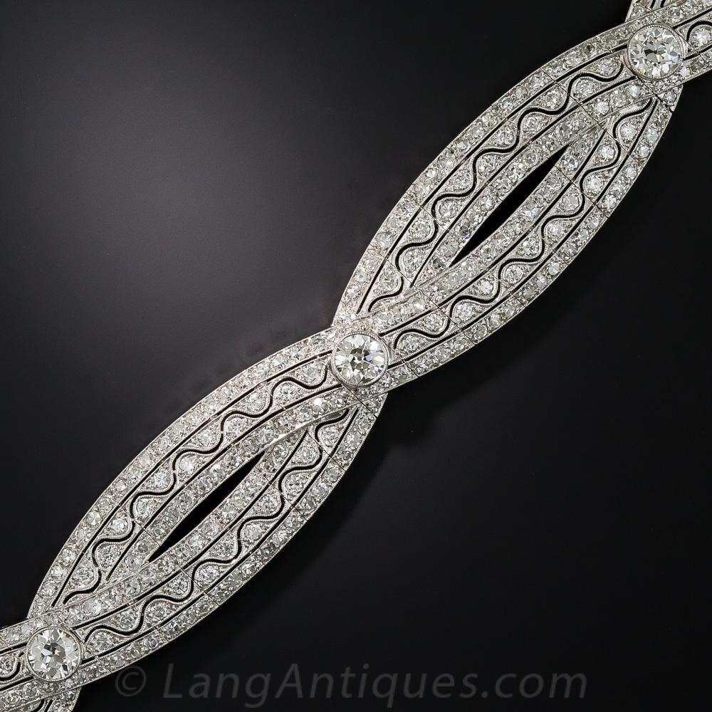 The superlative 'exquisite' barely begins to describe the intricate design and masterful workmanship that distinguishes this resplendent Edwardian/early-Art Deco jewel. Hand-fabricated in platinum during the second decade of the twentieth century,