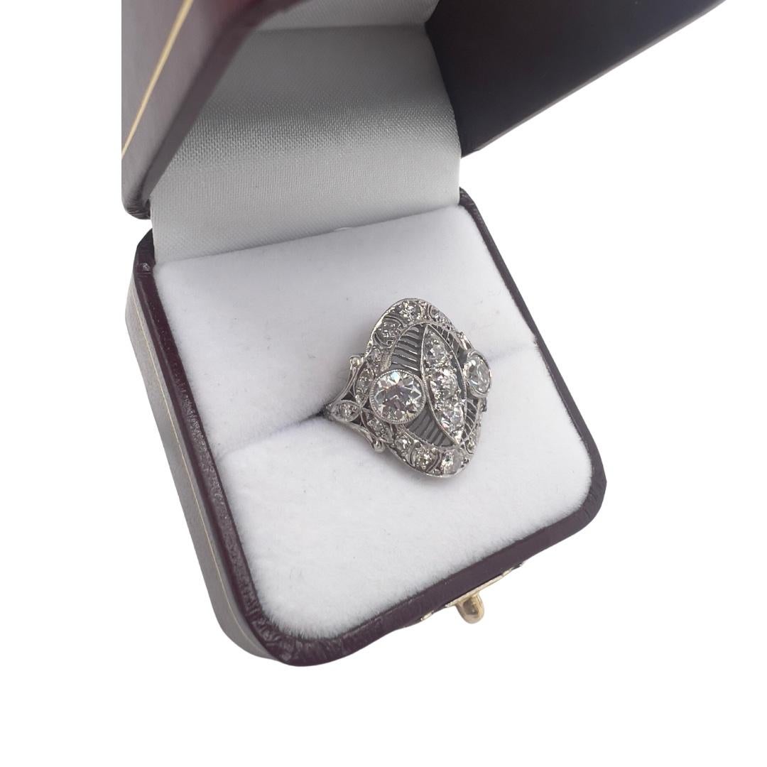 Step back in time and immerse yourself in the elegance and charm of the 1920s with this exquisite Edwardian platinum and diamond ring. Crafted with utmost precision and adorned with captivating details, this enchanting piece is sure to steal