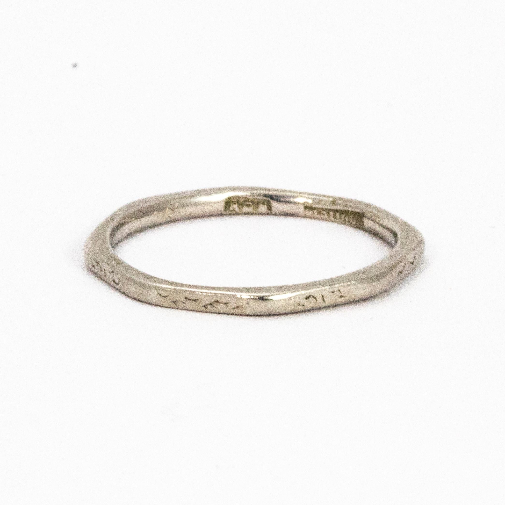 This ring looks quite geometric with its straight edges and has slight detail to every side. 

Ring size: K or 5