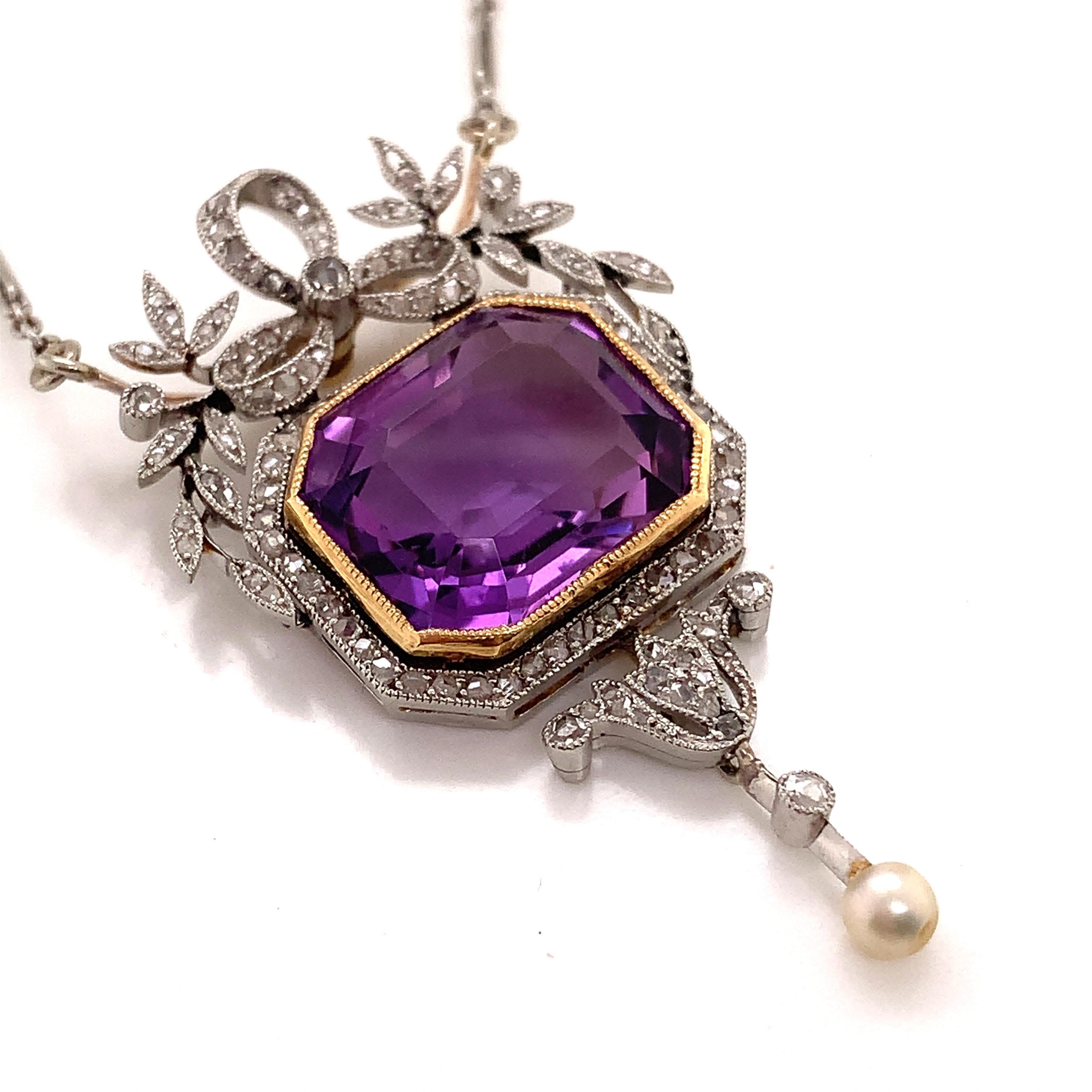 Edwardian platinum diamond and amethyst pendant necklace 
weight 13.8g 
size 4.5*2.5cm without chain  
amethyst size: 1.5*1.3cm 
chain length 21cm*2