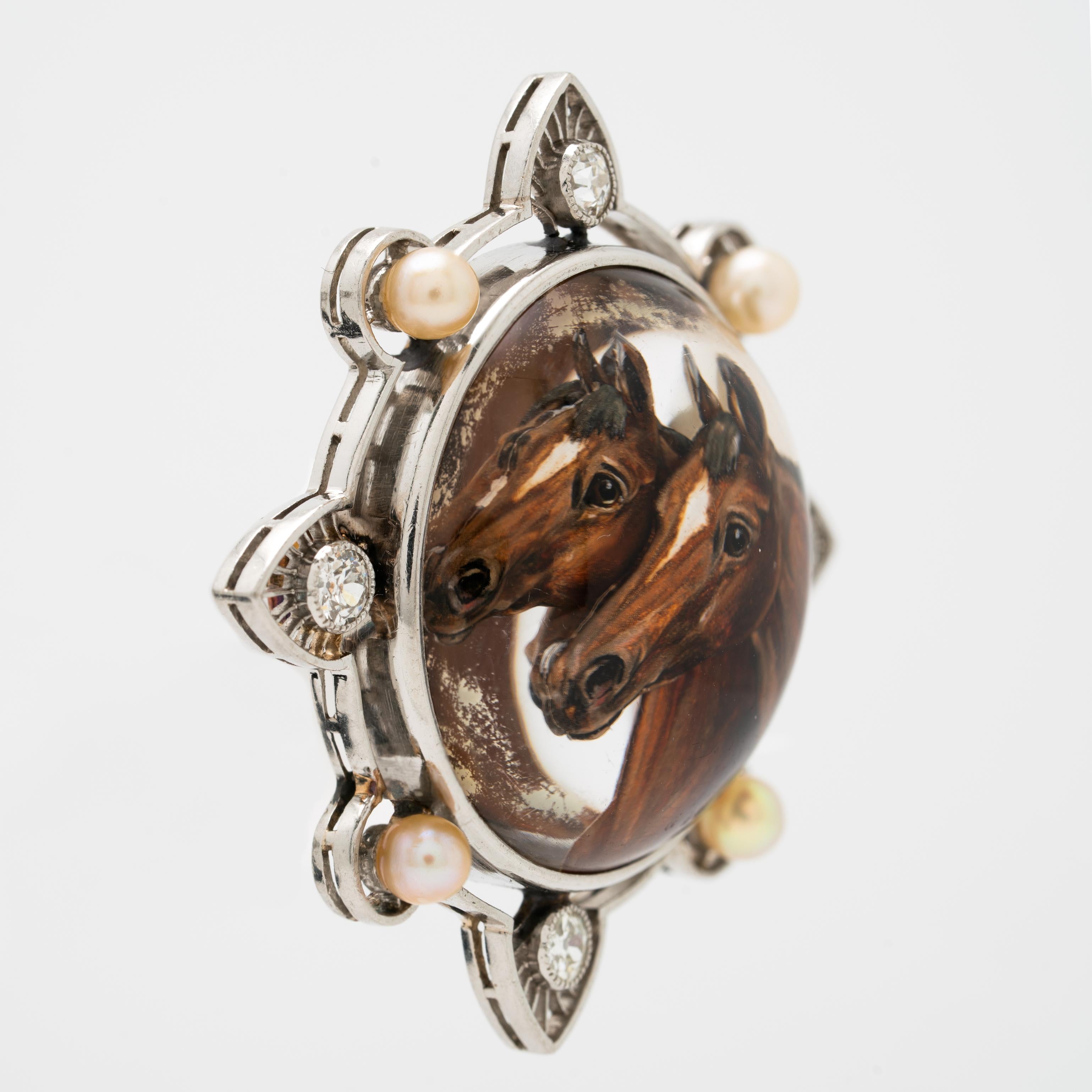 Edwardian Platinum Diamond and Pearl Reverse Carved Rock Crystal Equestrian Brooch c.1910

Essex crystal jewelry utilizes reverse glyptography — the art of gemstone carving — to create the illusion of a three-dimensional picture inside a domed