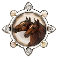 Edwardian Platinum Diamond and Pearl Reverse Carved Rock Crystal Equestrian Pin