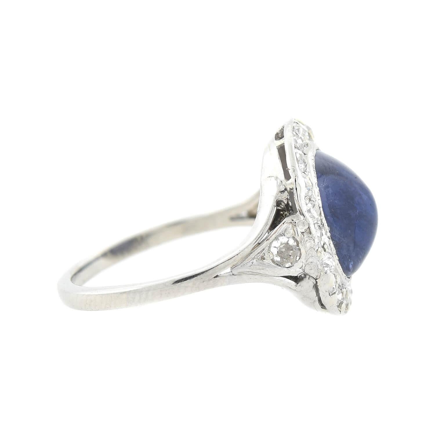 A gorgeous sapphire cabochon ring from the Edwardian (ca1910s) era! Handmade and crafted in platinum, this ring adorns a 3ctw+ no-heat Ceylon sapphire cabochon. The sapphire displays a stunning blue hue, complemented by its milgrained bezel setting