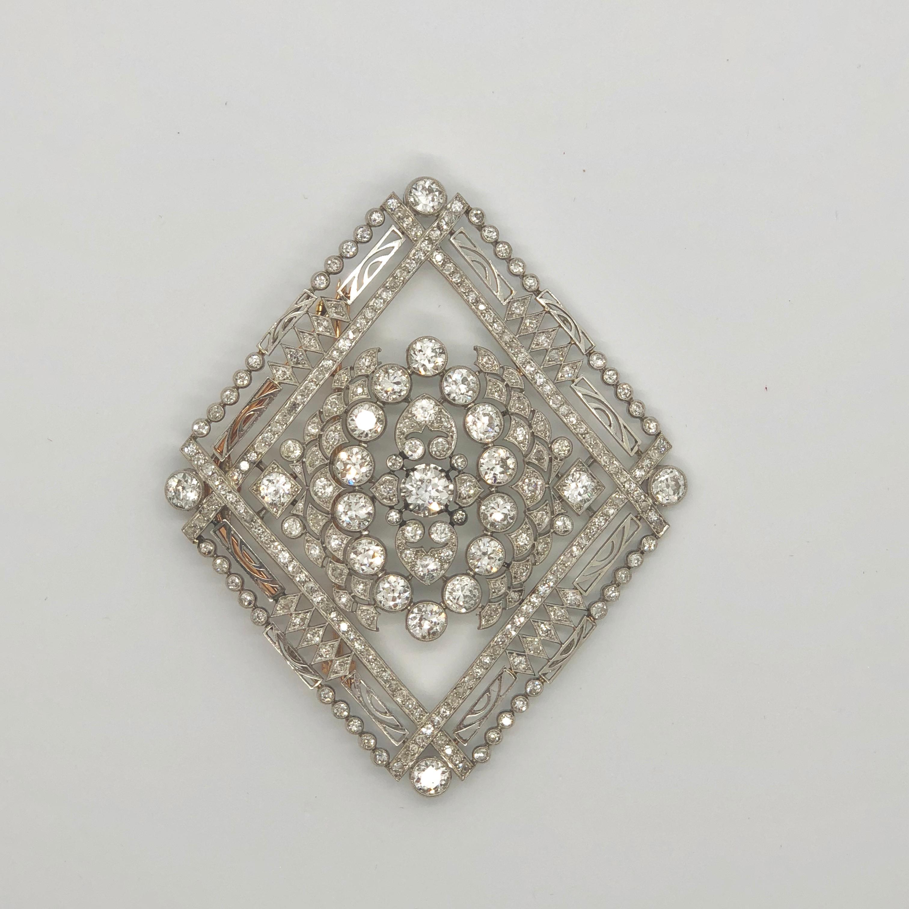 A big Edwardian diamond brooch in platinum, 1920s. The diamonds weigh circa 17 carats in total, including 21 bigger brilliant diamond solitaires. It is a magnificent piece with a lovely symmetry. It can be worn as a brooch or pendant - with French
