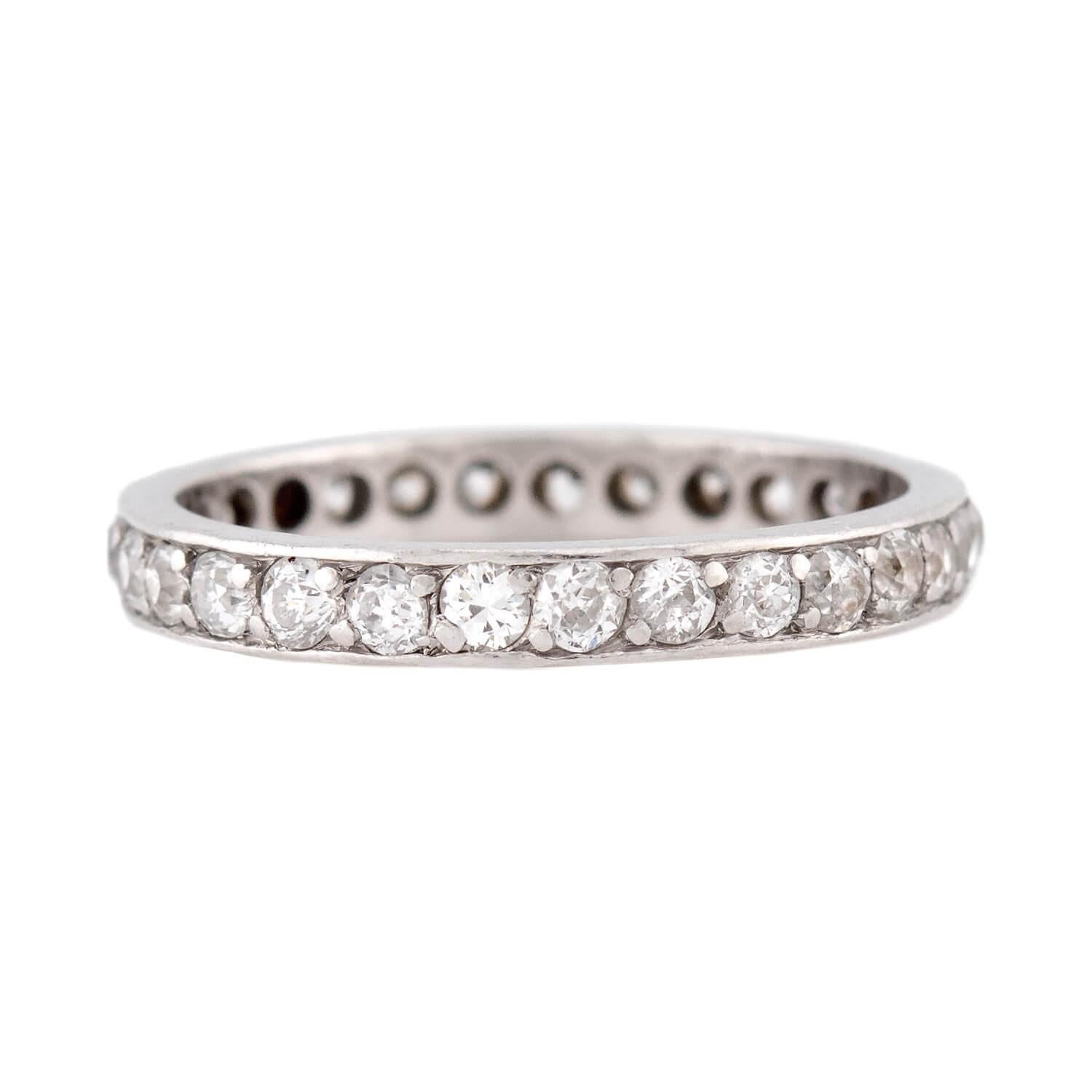This diamond eternity band is a stunning piece from the Edwardian (ca1910s) era! Crafted in platinum, the ring features a single row of old mine cut diamonds, which are all bead-set. The stones have an approximate total carat weight of 3ctw and