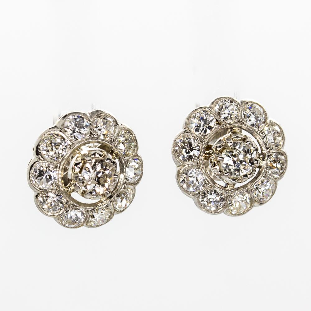 Period: Edwardian (1901-1920)
Composition: Platinum 
Stones:
•	2 old mine cut diamond H-SI1 0.60ctw
•	20 old mine cut diamonds H-VS2 1.40ctw
Earrings measure: 13mm in diameter.¬
Thickness: 6mm.
Total weight:  4.5grams – 2.9dwt
Appraisal available