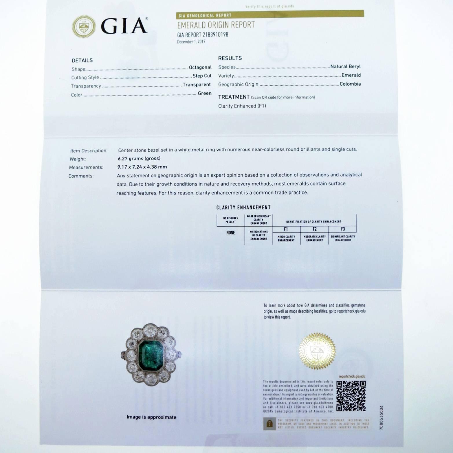 Handmade platinum mount emerald and diamond ring. The center is set with a natural GIA report  #2183910198 octagonal step cut emerald measuring 8.1mm. x 7.24mm. x 4.38mm. weighing approx 2.0cts. surrounded with 12 old European cut diamonds totaling