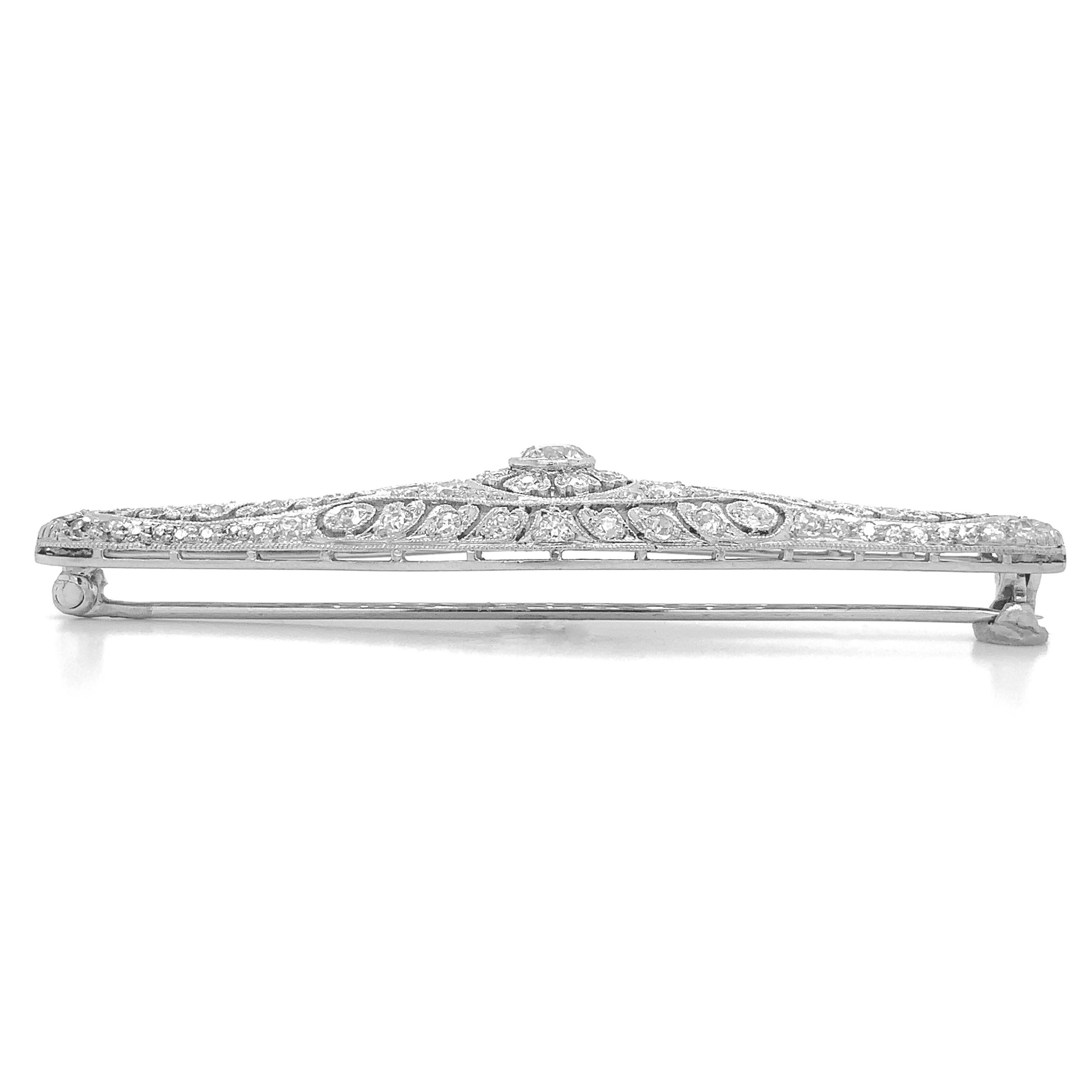 Edwardian platinum diamond filigree floral pin brooch with about 1.50 carats of diamonds. This is a large pin measuring 2 3/8