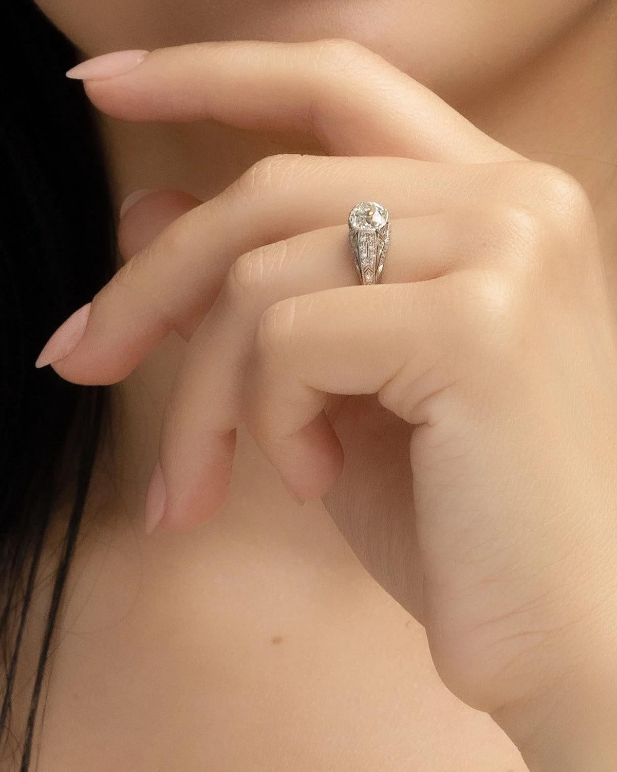 
Ring Size: 6.5
Metal Type: Platinum [Hallmarked, and Tested]
Weight: 4.1 grams

Center Diamond Details:
GIA LAB REPORT #:5222897038
Weight: 1.33ct
Cut: Old Mine Brilliant
Color: K
Clarity: SI2
Measurements: 6.76mm x 6.41mm x 4.40mm

Side Diamond