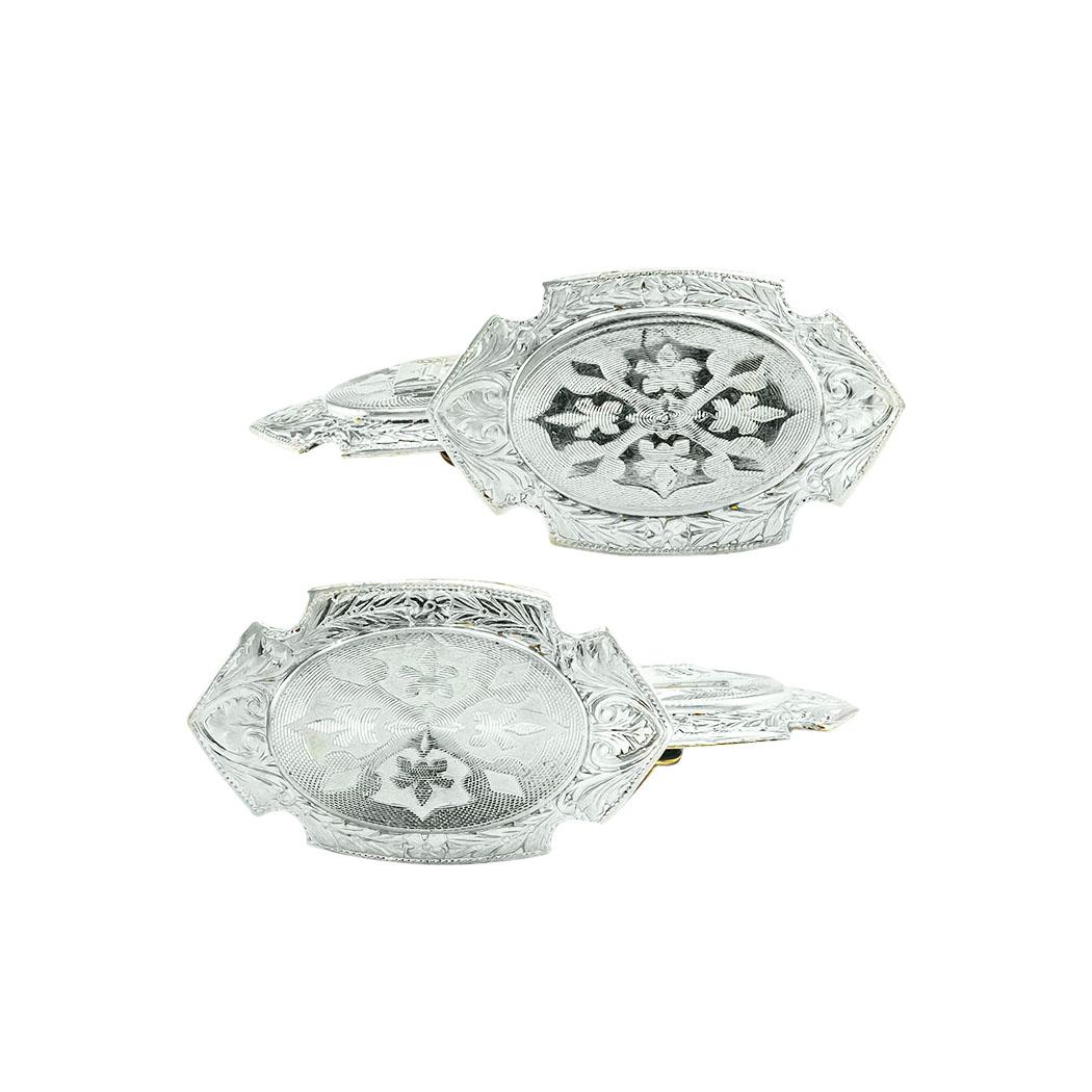 Edwardian platinum and gold double-sided and engraved cufflinks circa 1910. *

ABOUT THIS ITEM:  #C-DJ913A. Scroll down for specifications.  Crafted in platinum over gold, each of the four rectangular faces features elaborate engraving and chase