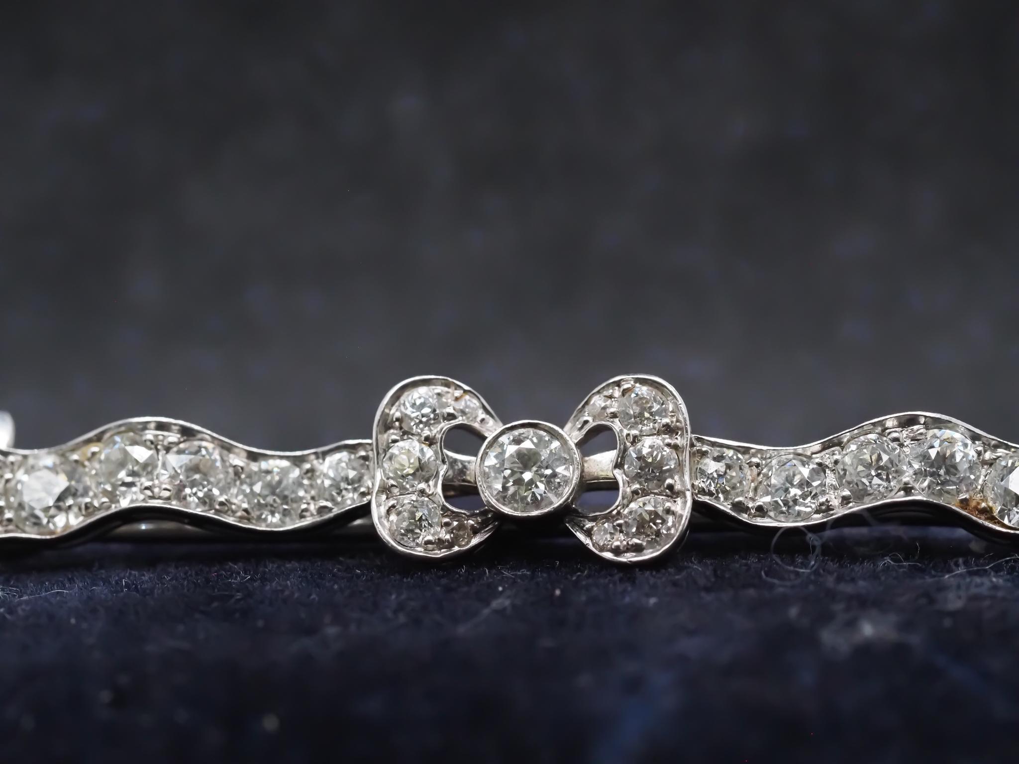 Old European Cut Edwardian Platinum Tiffany & Co. Old European Diamond Ribbon Brooch For Sale