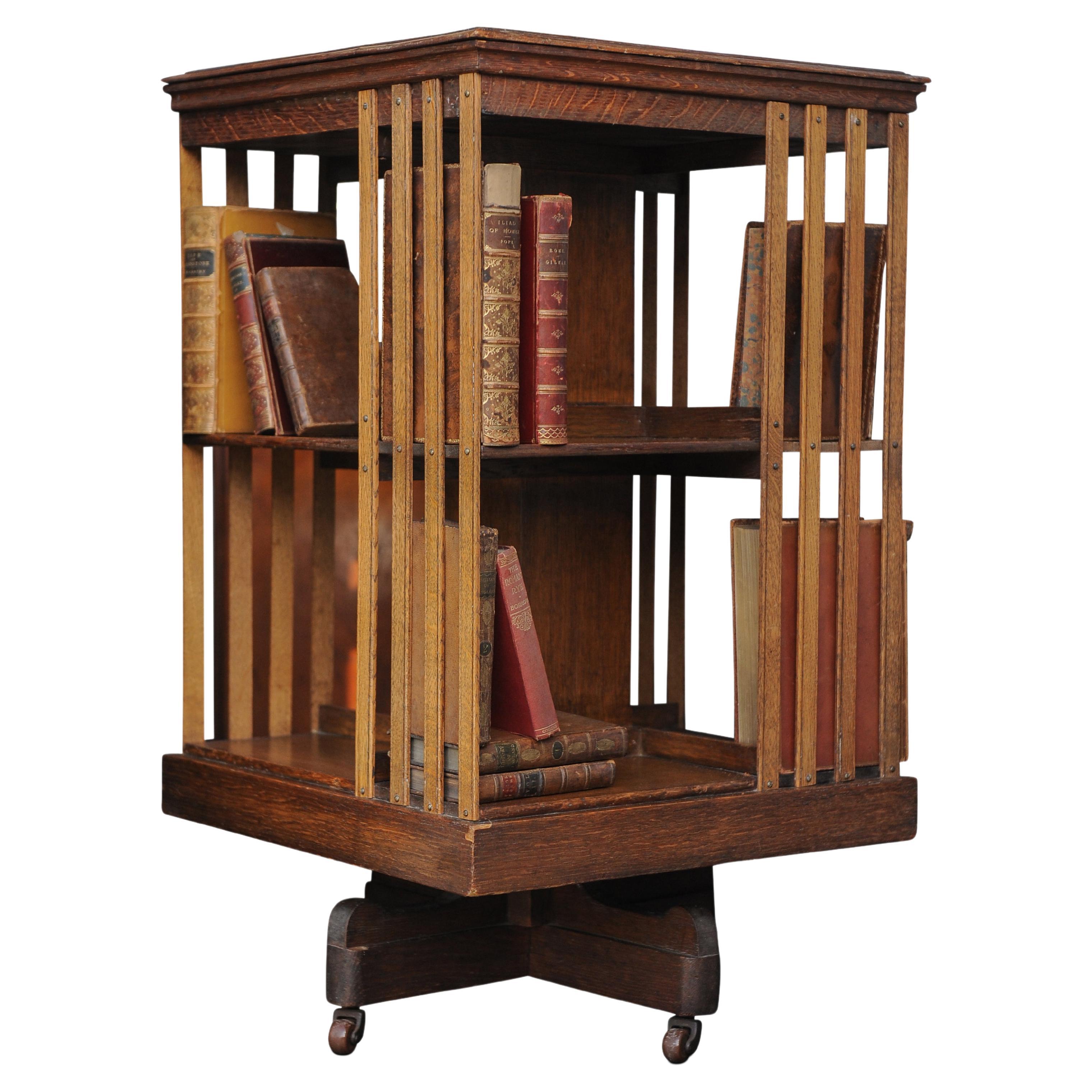 British Edwardian Revolving Two Tier Oak Library Bookcase With Porcelain Castors  For Sale
