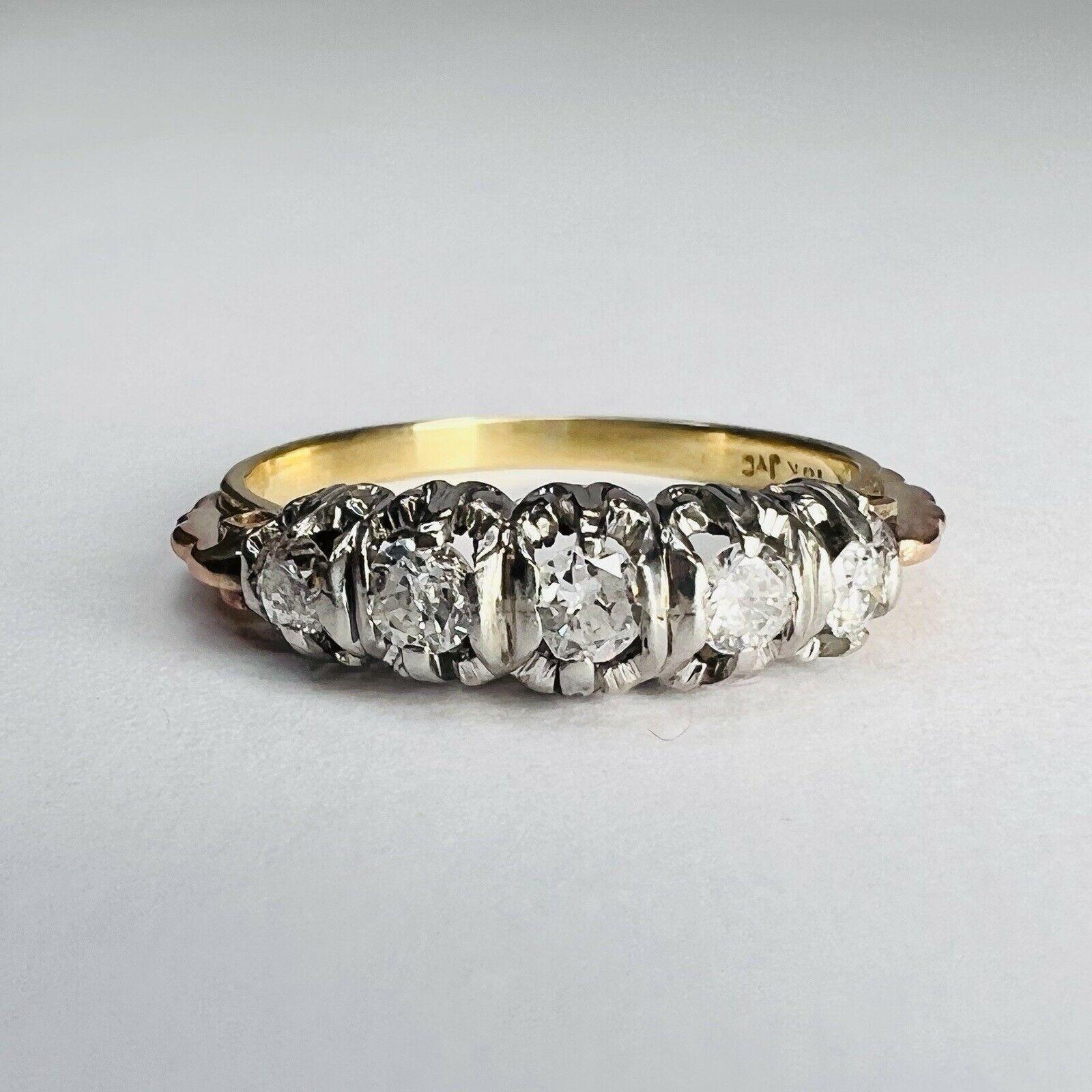 Presenting A:

Solid 18K Yellow Gold and Platinum set Diamond Edwardian Ring Band Size 6.75

There are natural diamonds prong set in platinum on a 18K Yellow gold ring band 

The diamonds are natural and earth mined about .50CTW

The Ring is 4mm