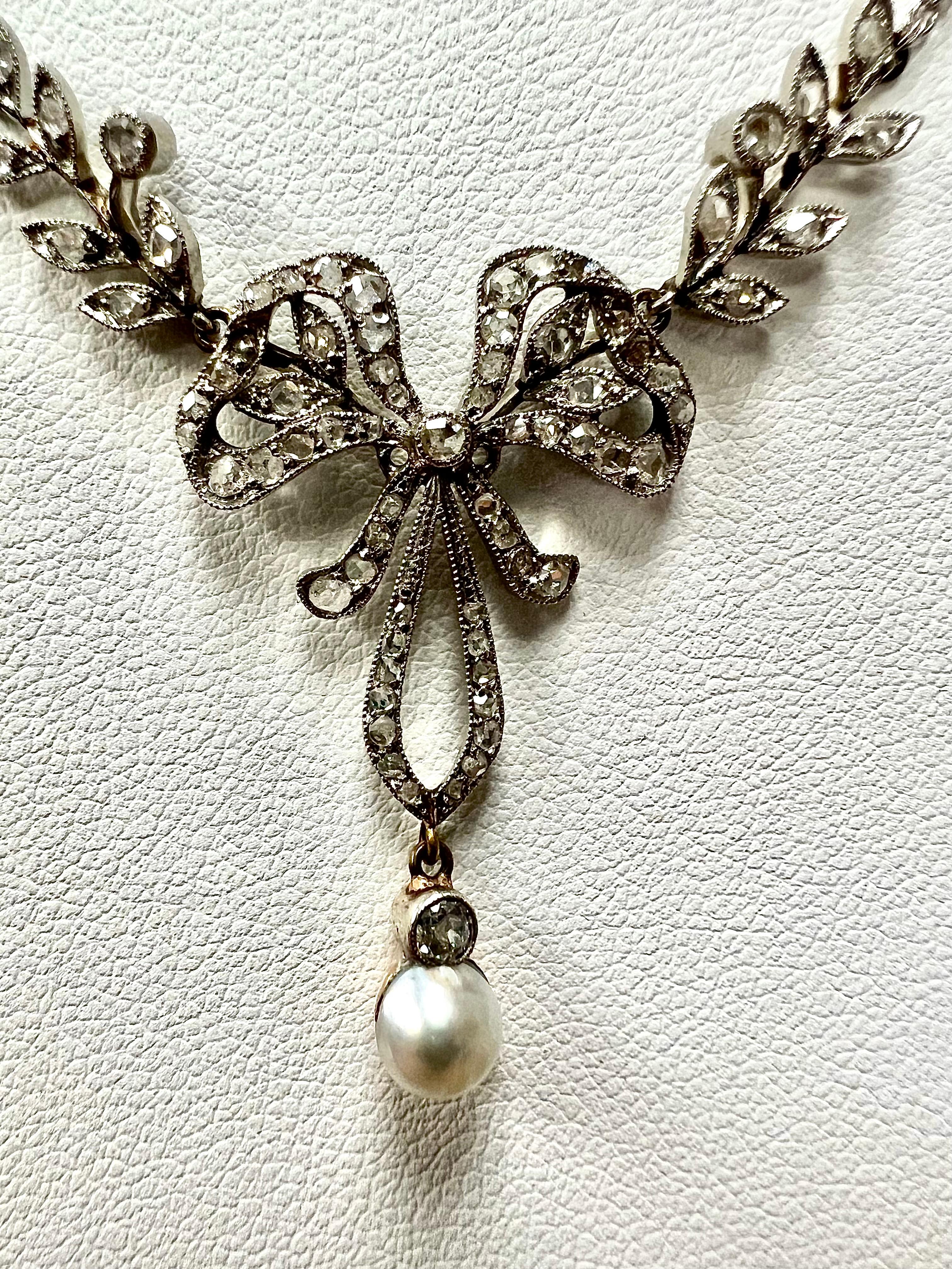 Edwardian Rose Cut Diamond Pearl Bow Platinum and white gold necklace, circa 1910.

ABOUT THIS ITEM: N-DJ111H   The Edwardian era, spanning from 1901 to 1910, was a time of elegance and refinement in the world of fashion and jewelry. One exquisite