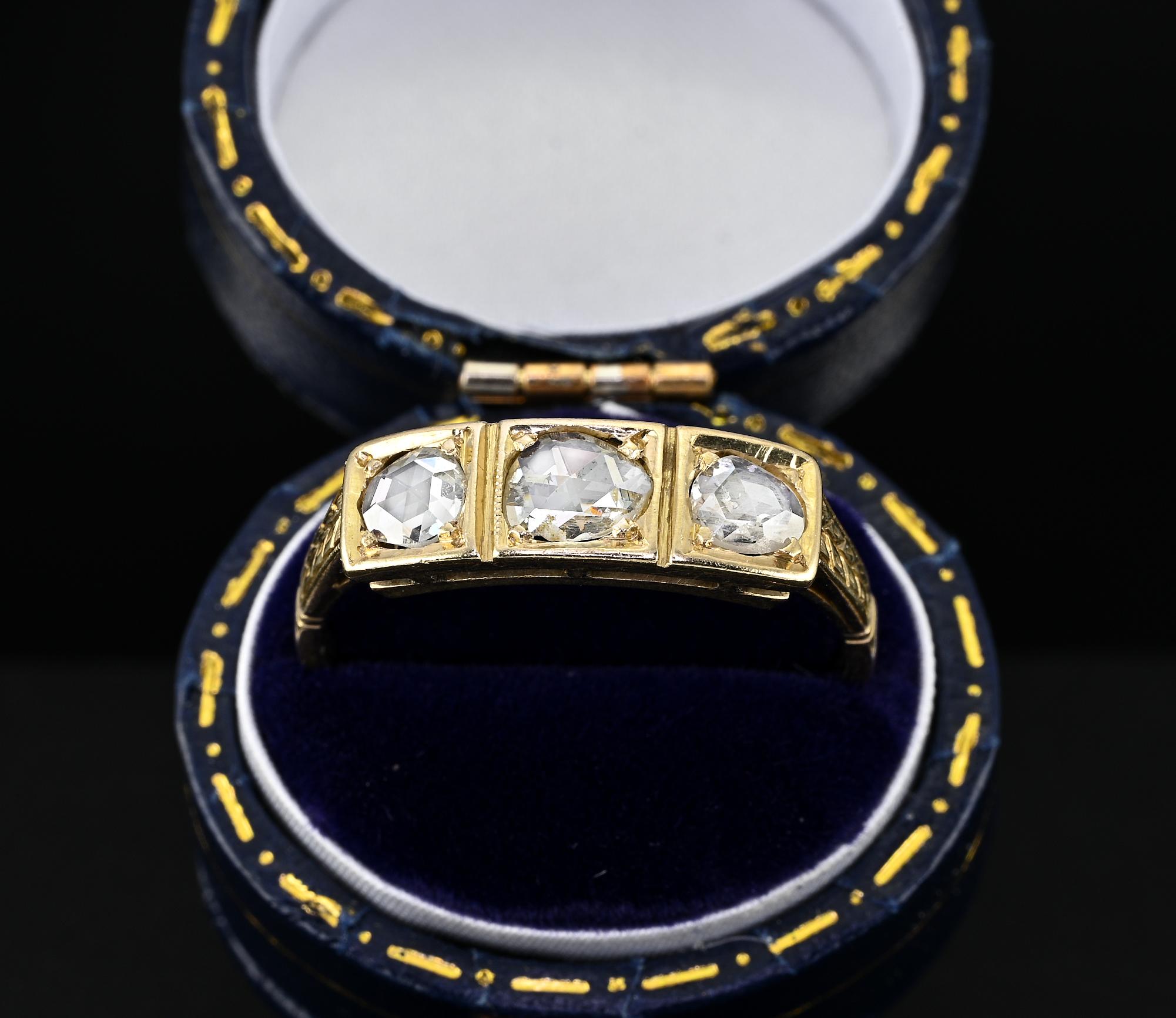 An antique gent ring from the Edwardian period 1910 circa
Hand crafted of solid 18 Kt gold with a lovely design distinctive of the era
Flat head facing up with a beautiful row of three Rose cut Diamonds each cased in a square mount Diamonds 
