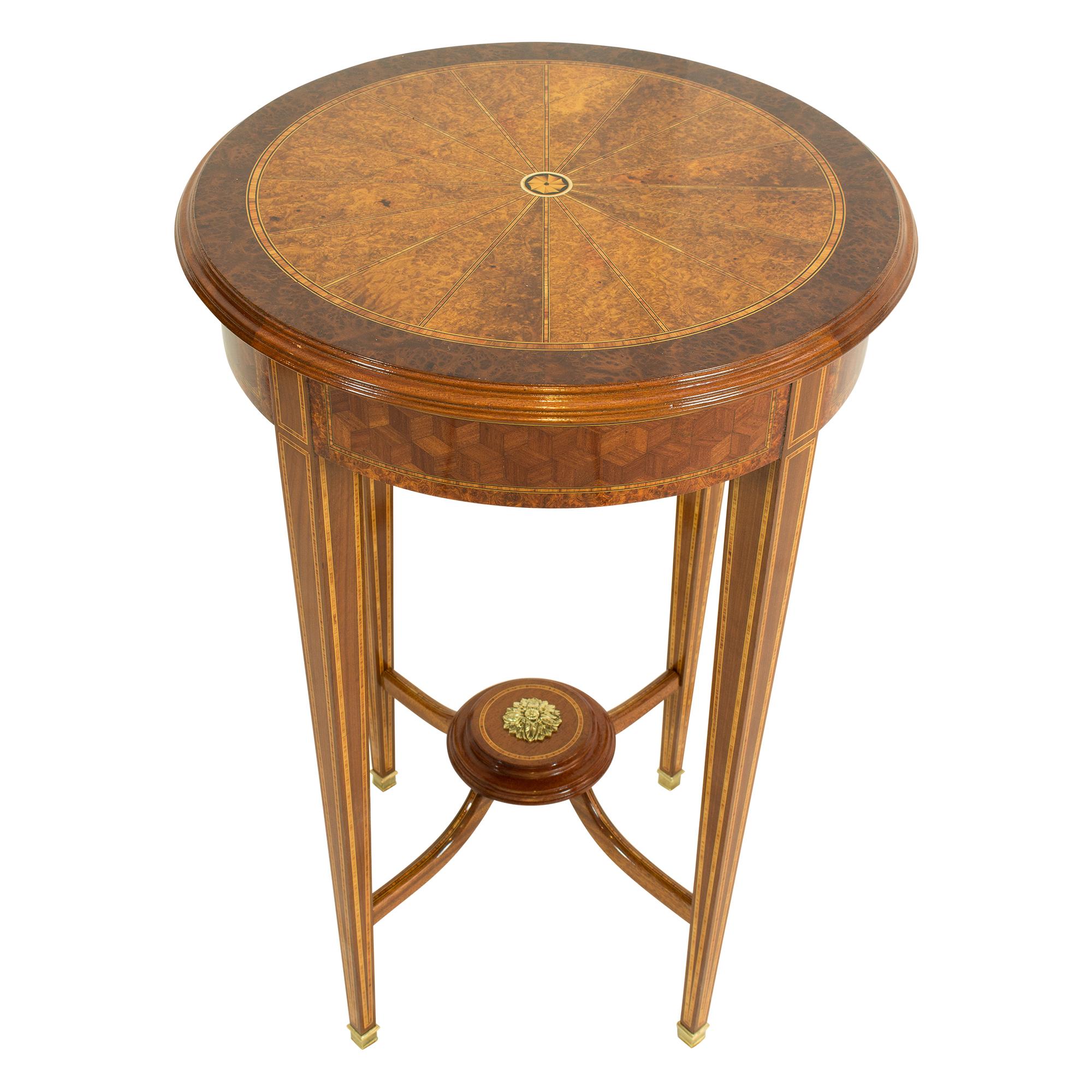 Beautiful simple side table from the Edwardian period circa 1900 from England. The table is made of walnut/nutwood and decorated with band inlays and cubes marquetry in different woods. Feet are edged with brass shoes. The table is in a very good