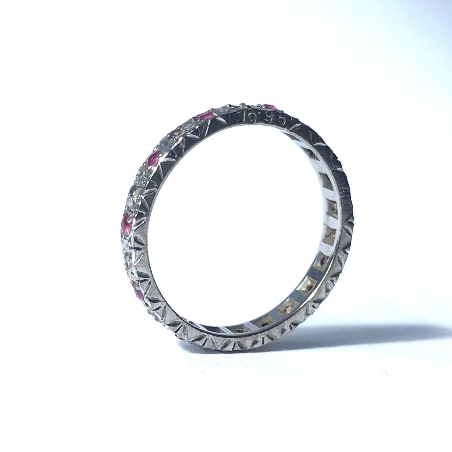 Set within this 18ct white gold band are 5pt rubies and the diamonds which sit in between every gorgeous pink ruby measure 3pts each. The balance of the pink and clear bright sparkle is beautiful. 

Ring Size: R or 8 1/2 
Band Width: 3mm

Weight: