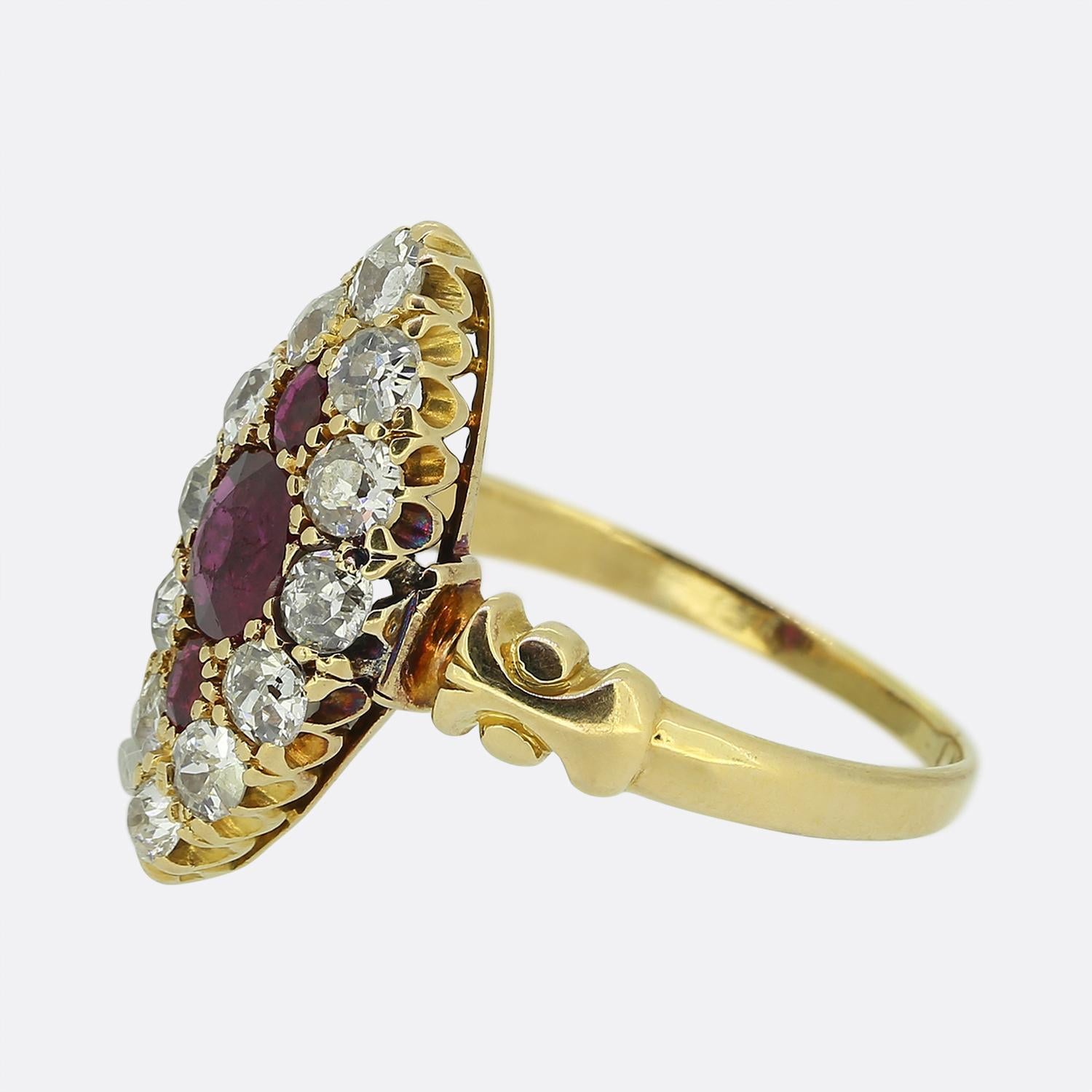 Here we have an excellently crafted navette ring taken from the Edwardian period. This 18ct yellow gold piece showcases the typical boat-like shaped head with a trio of perfectly matched rich red rubies at the centre. These focal stones are then