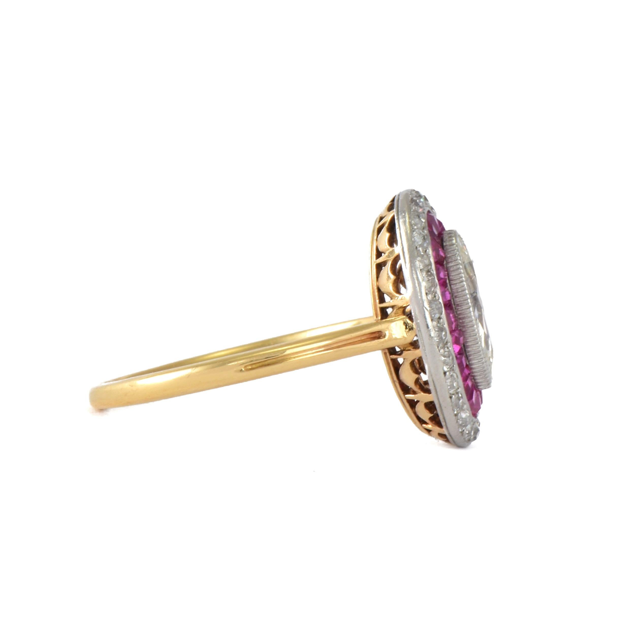 Superb Edwardian period marquise ring.

 

Expertly crafted from 18k gold and platinum with carved gallery.

 

The ring features a old cut marquise diamond in milgrain setting. This is surrounded with Exceptional caliber cut rubies and further