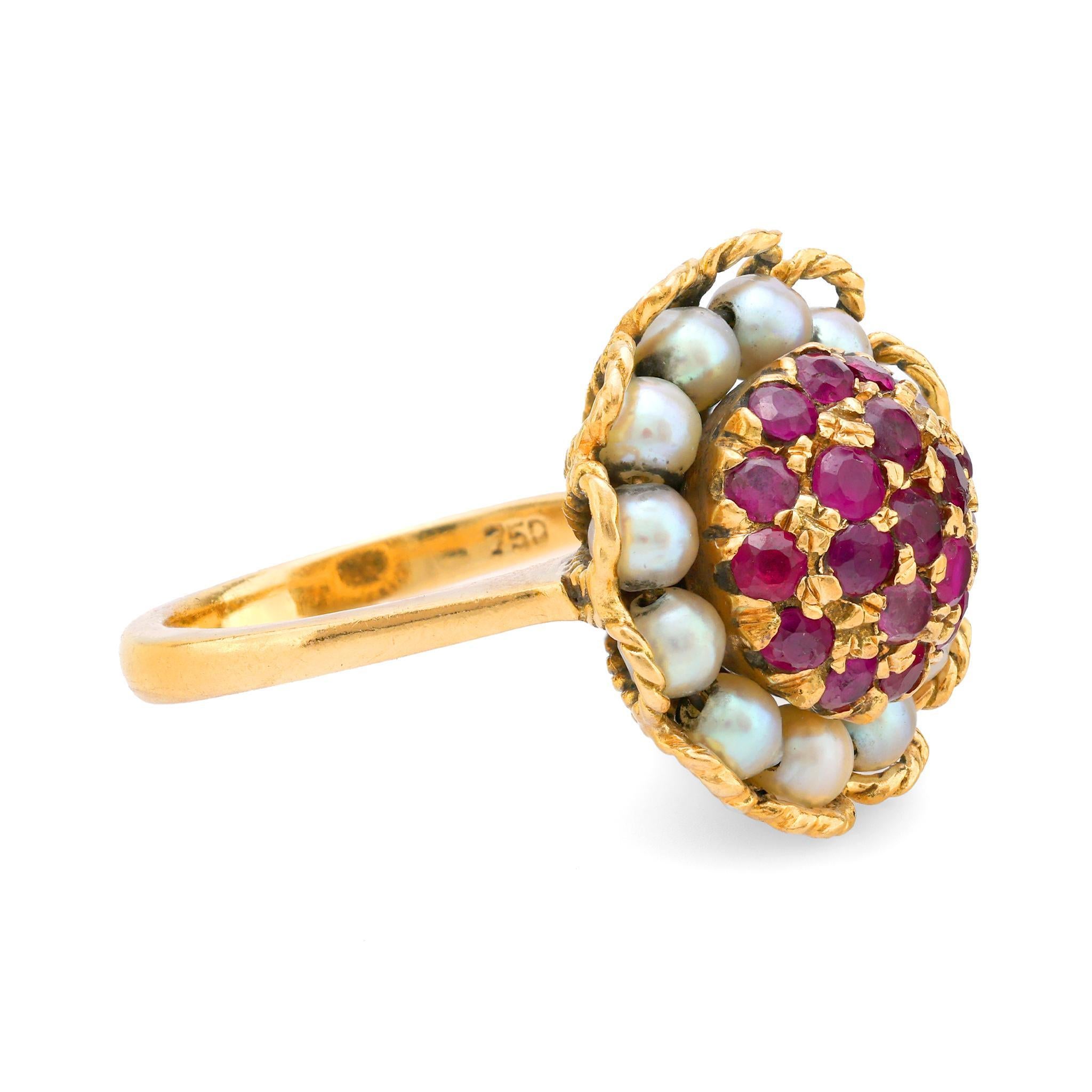 This Edwardian 18k yellow gold ring from the 1910s showcases 19 brilliant rubies alongside luminous pearls, creating a timeless and elegant design.

Center stone: 19 round brilliant cut rubies
Weight: Approximately 1.50 carats
Accent stone: 12