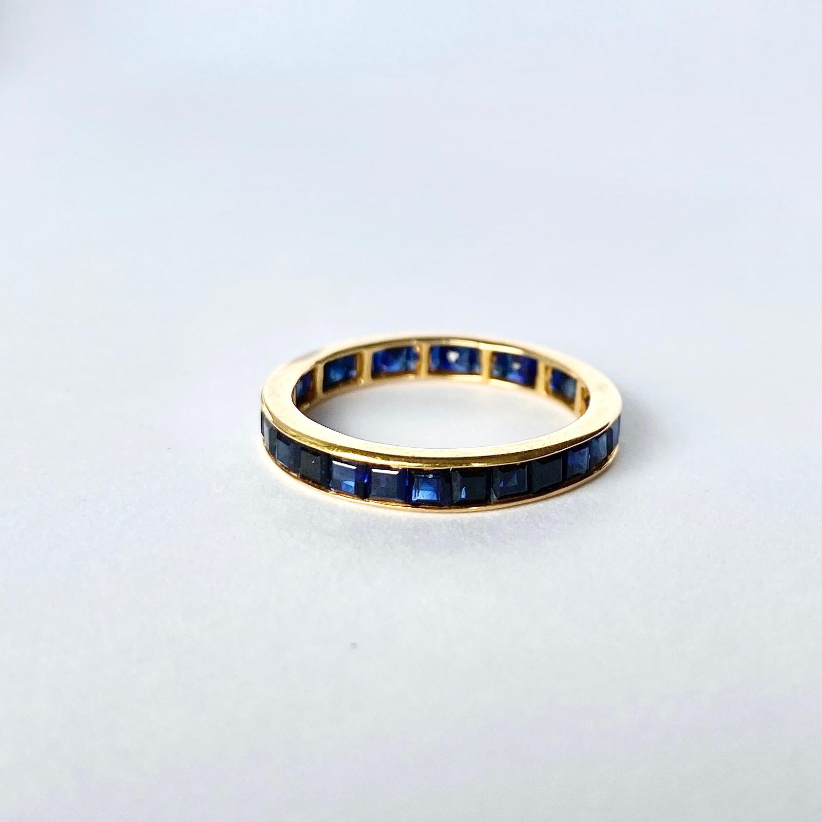 A shining halo of Sapphires is the show stopping detail on this ring. Set in a 18carat gold band which compliments the rubies perfectly. Ruby total approx 1.1carat. 

Ring Size: J 1/2 or 5 
Band Width: 2mm

Weight: 1.6g
