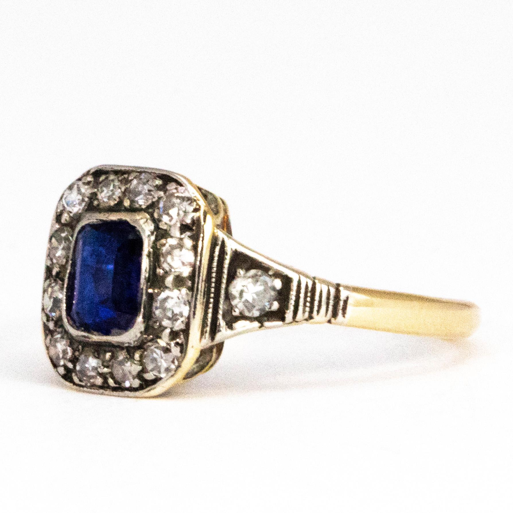 This ring has a very classic style. The centre stone is a bright blue sapphire and surrounding it are gorgeous diamonds. The sapphire measures 20pts and the diamonds measure 3pts each. 

Ring Size: K 1/2 or 5 1/2 
Cluster Dimensions: 9.5mm x