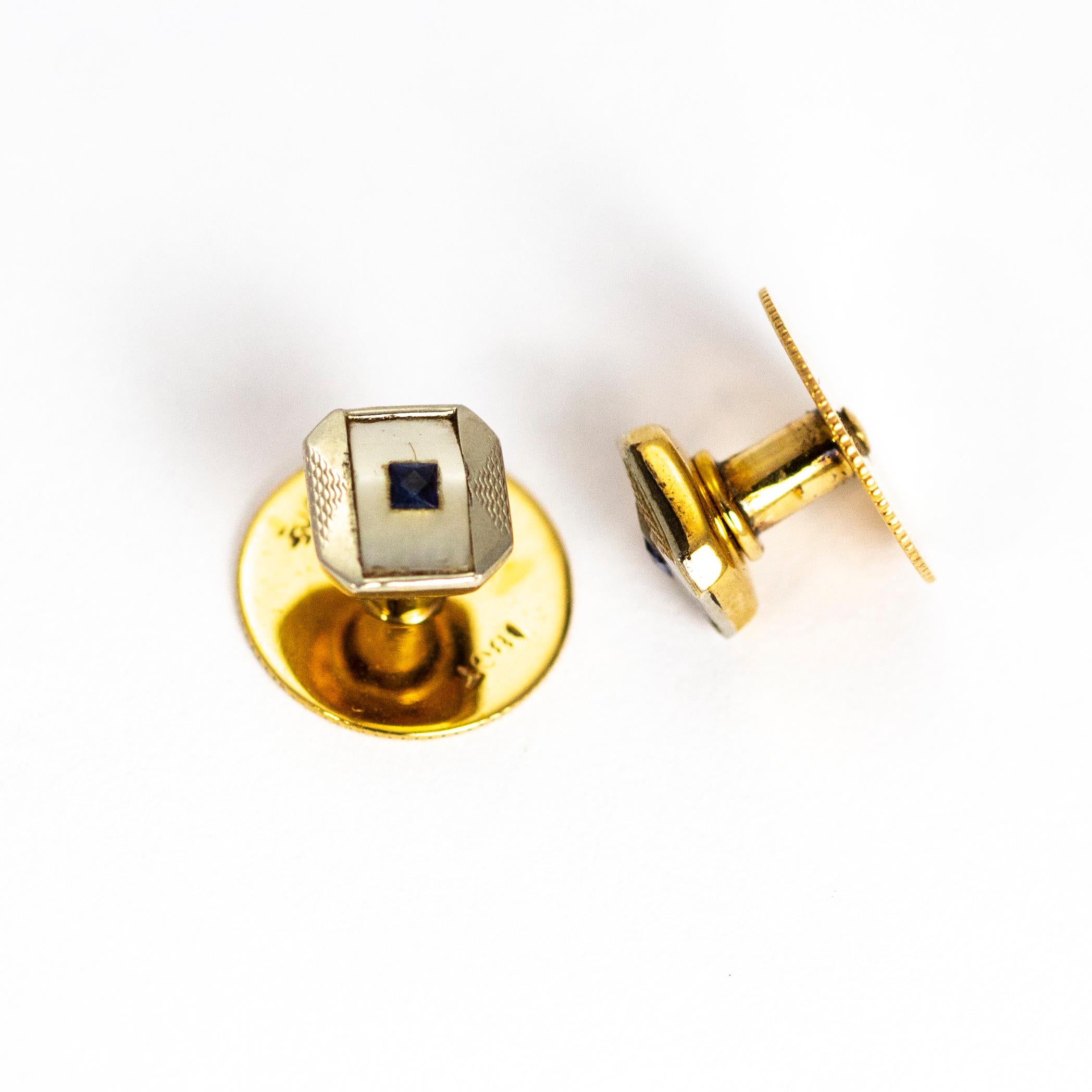 This stunning Edwardian cuff link and stud set come complete in their original fitted box. Each link or stud feature a mother of pearl panel with either a square cut diamond or sapphire at the centre. These are modelled out of 9ct and 18ct Gold and