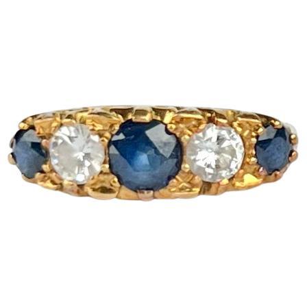 Edwardian Sapphire and Diamond 18 Carat Gold Five-Stone Ring