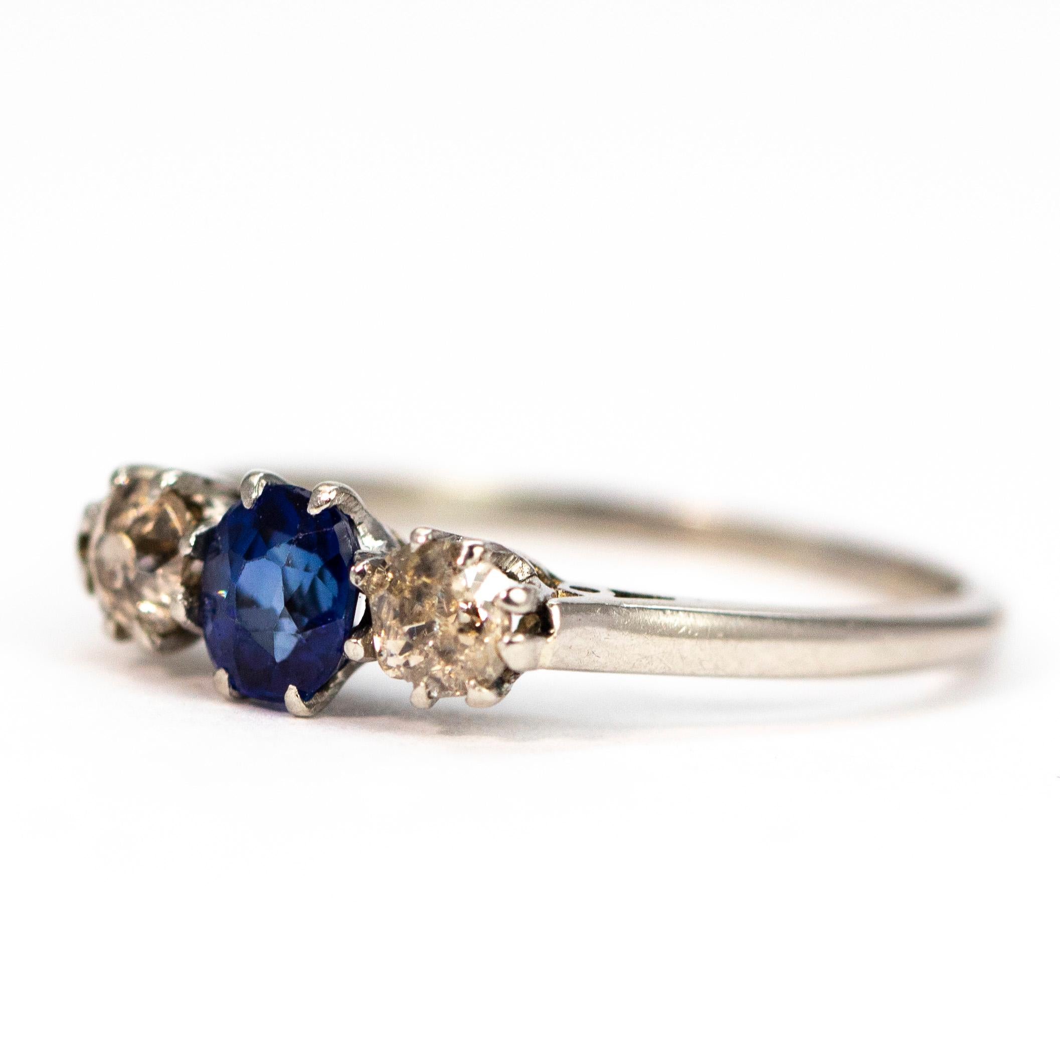 This three stone ring hold a central sapphire which is a lovely bright blue colour and measures 30pts. Either side of this central stone is a diamond which measures 15pts each and are bright and sparkly. The ring is modelled in platinum.

Ring Size: