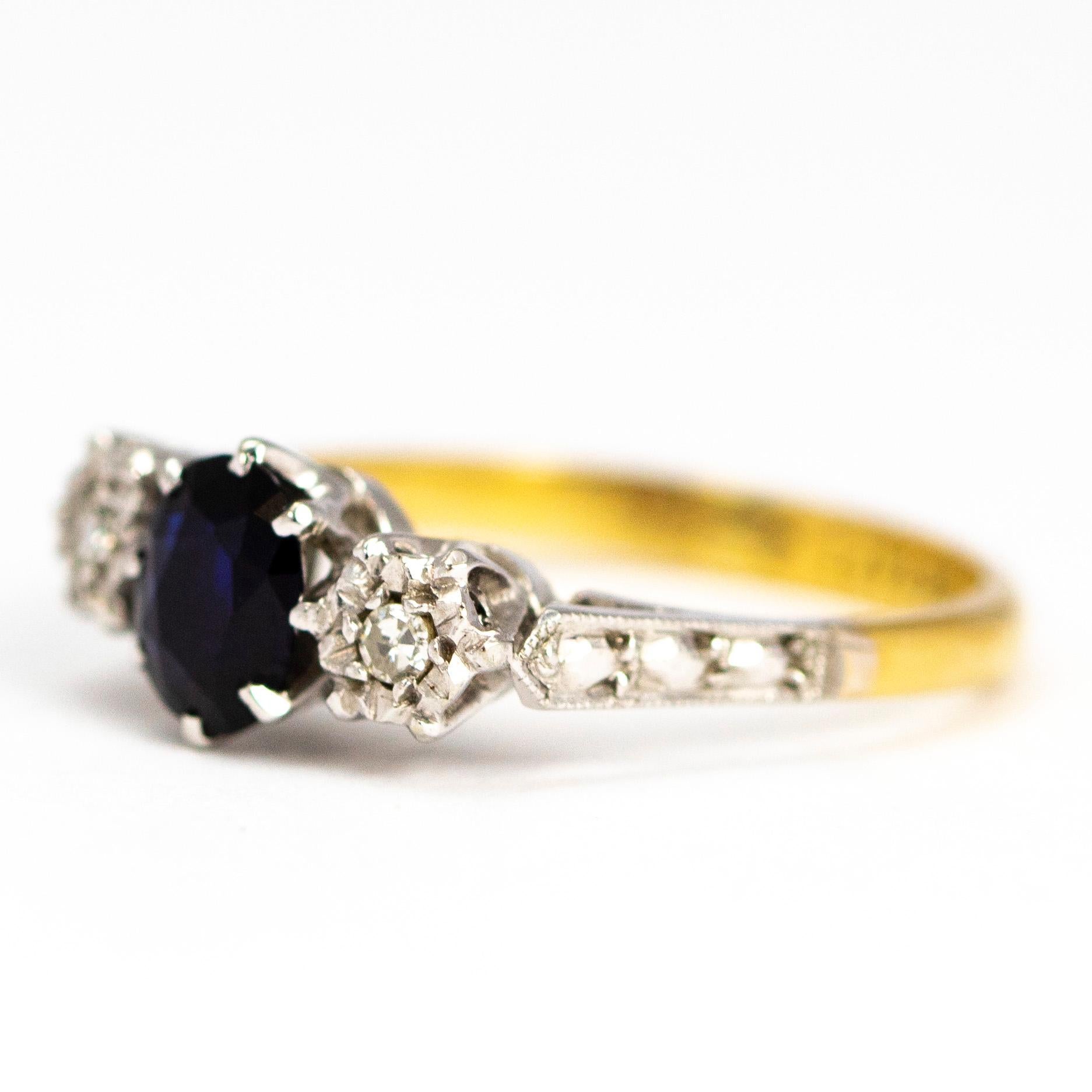 The three stones in this ring are set in platinum and the rest of the ring is modelled in 18ct gold. The central sapphire measures 60pts and the diamonds measure 5pts. 

Ring Size: J 1/2 or 5

Weight: 2.55g 