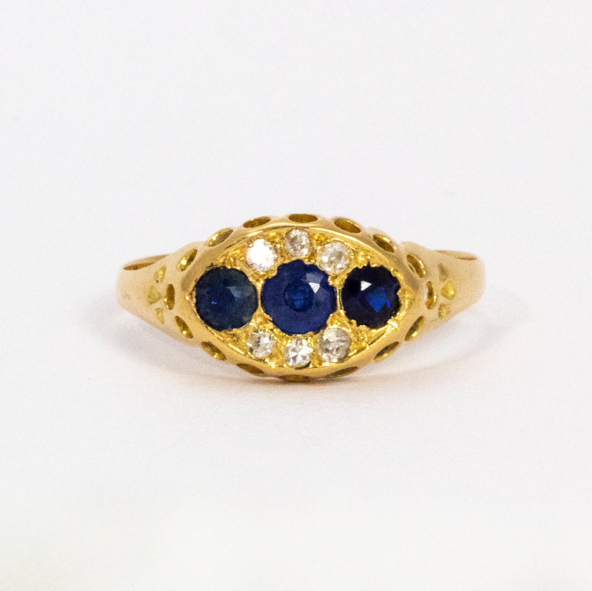 Three beautiful blue sapphires and six sparkling diamonds held by a very decorative 18ct gold ring.

Ring Size: N 1/2 or 7 