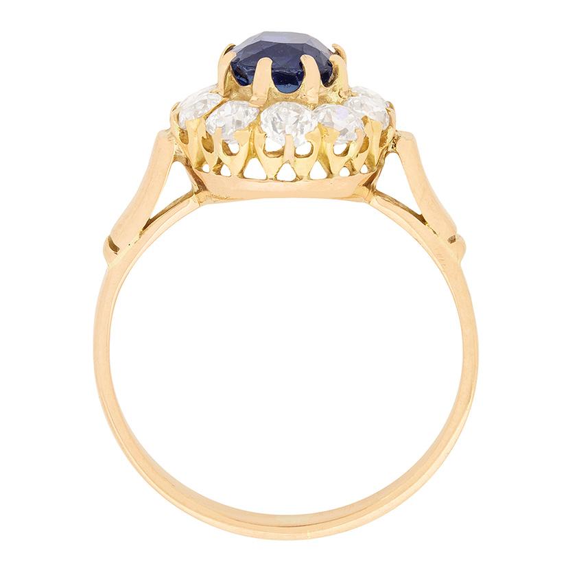 This stunning sapphire and diamond cluster ring dates back to the Edwardian era. Set in 18 carat rose gold, the claw set natural sapphire is surrounded by old cut diamonds, all VS2 in clarity and ranging from G-H in colour. The sparkling stones have