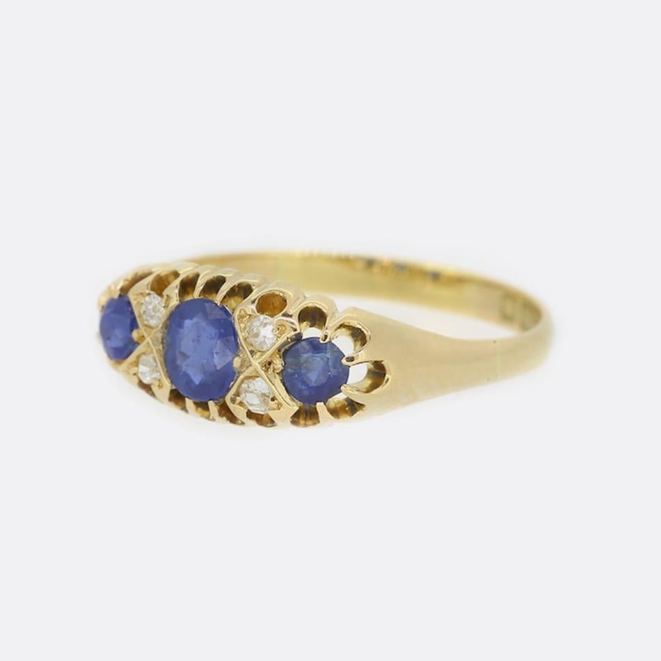 This is an Edwardian 18ct yellow gold sapphire and diamond ring. The sapphires are a lovely mid blue hue and are well matched for colour. The rich blue of the sapphires highly compliment the lovely white sparkle of the 4 old cut