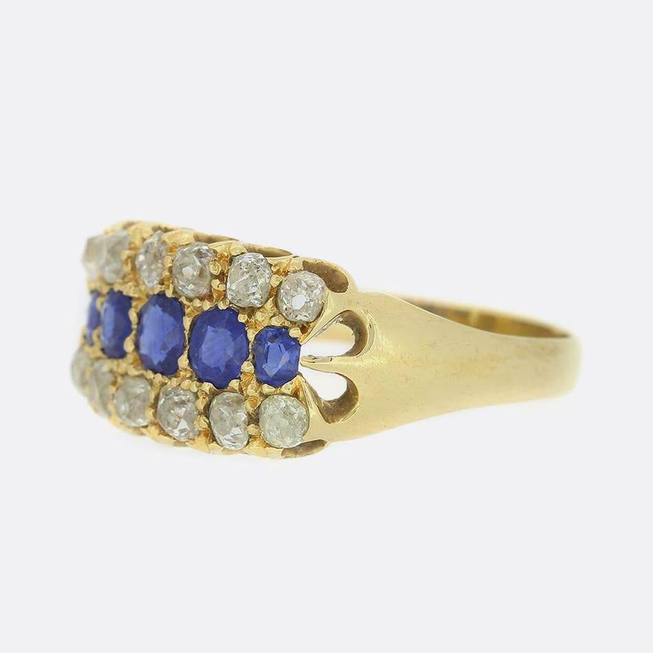 This is an Edwardian 18ct yellow gold sapphire and diamond ring. The sapphires are a medium to dark blue hue and the diamonds are lovely white old cuts. The deep blue of the sapphires highly compliment the lovely white sparkle of the