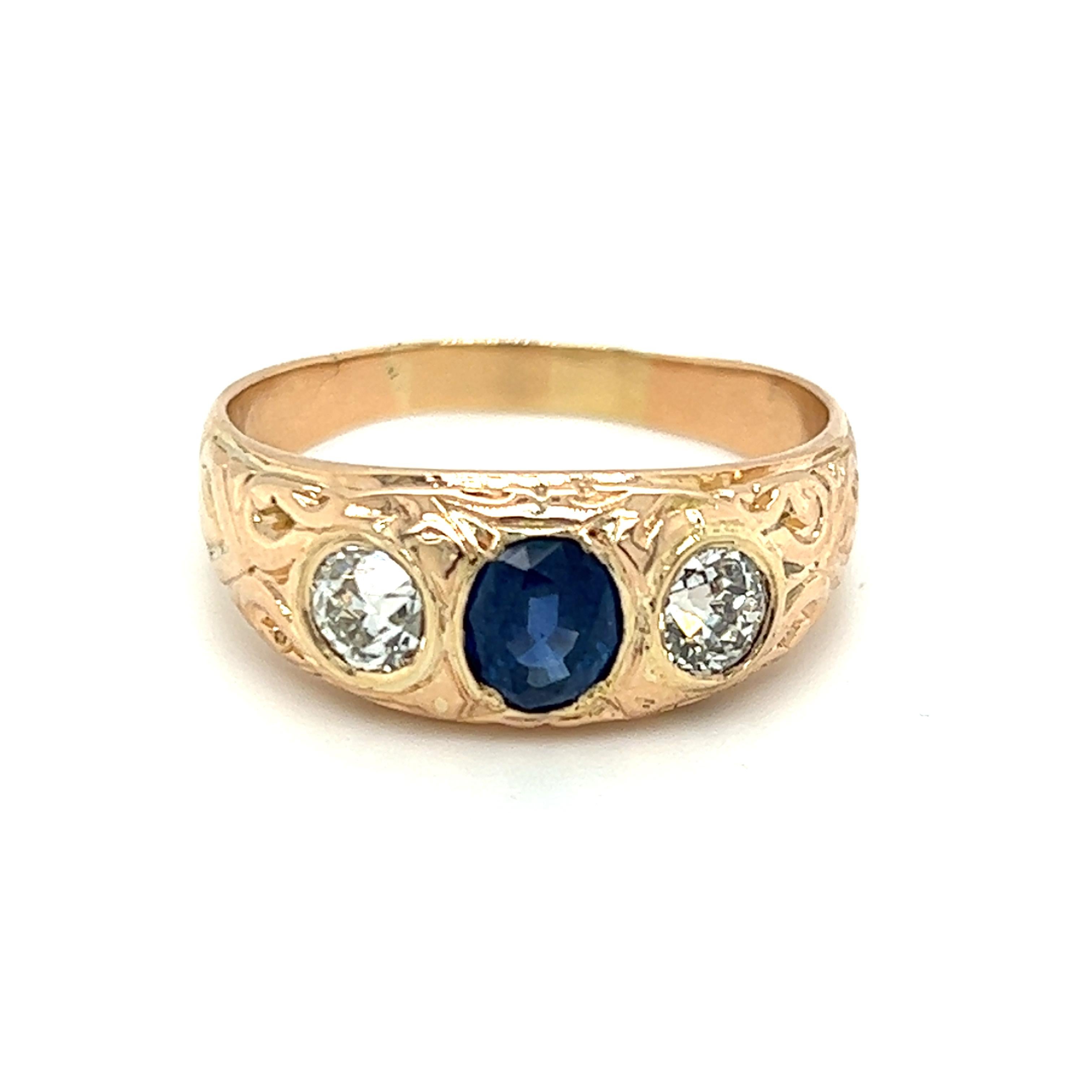 One 14 karat yellow gold Edwardian three stone ring, set with one (1) 6x5mm natural oval sapphire, flanked by two (2) 5.1mm old mine cut diamonds, approximately 1.00 carat total weight with matching IJK color and VVS2-SI1 clarity.  The ring is a