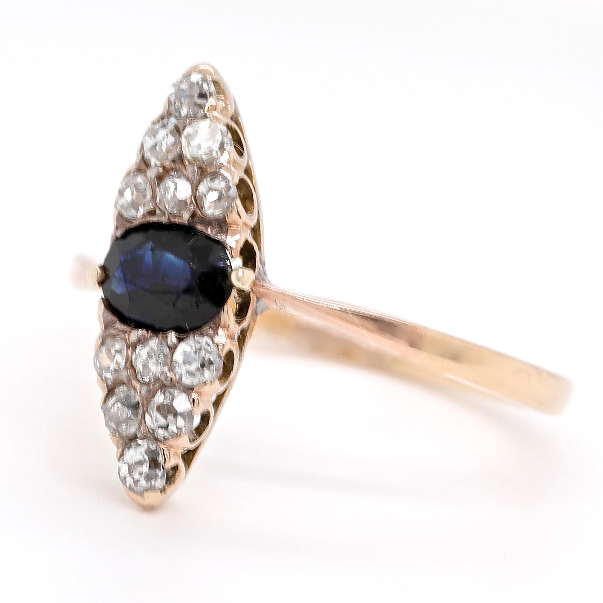 Are you looking for a one of a kind ring with antique history? A ring that will always belong in a palace? Feel yourself like royalty watching The Crown while wearing this beauty. The ring is an Edwardian Sapphire Diamond 14k Gold Cluster Navette
