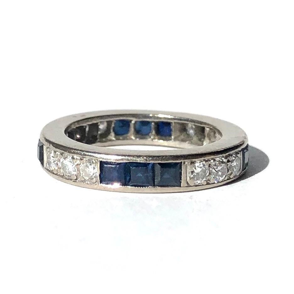This fabulous eternity band has a chunky feel and the stones are a great size. The diamonds measure 10pts each and are in four groups of three and the sapphires also measure 10pts and are set in the same way. The ring is modelled in platinum. 

Ring