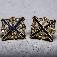 «Gemelos eduardianos con zafiro y diamantes en forma de cruz de San Andrés, hacia 1910»