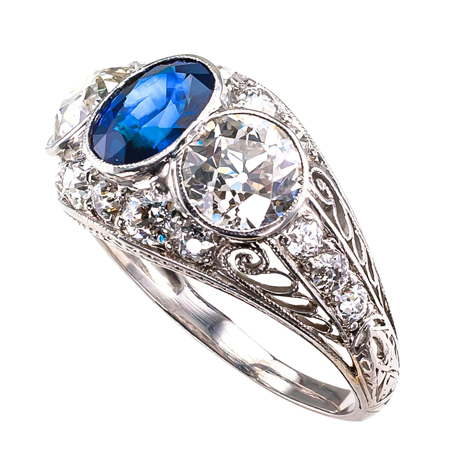 DETAILS:

Edwardian diamond and sapphire three-stone platinum ring circa 1910.

DIAMONDS: two old European-cut diamonds totaling 2.02 carats, accompanied by a reports from EGL-USA stating that the diamonds are I – J color and VS1 clarity.

SMALL