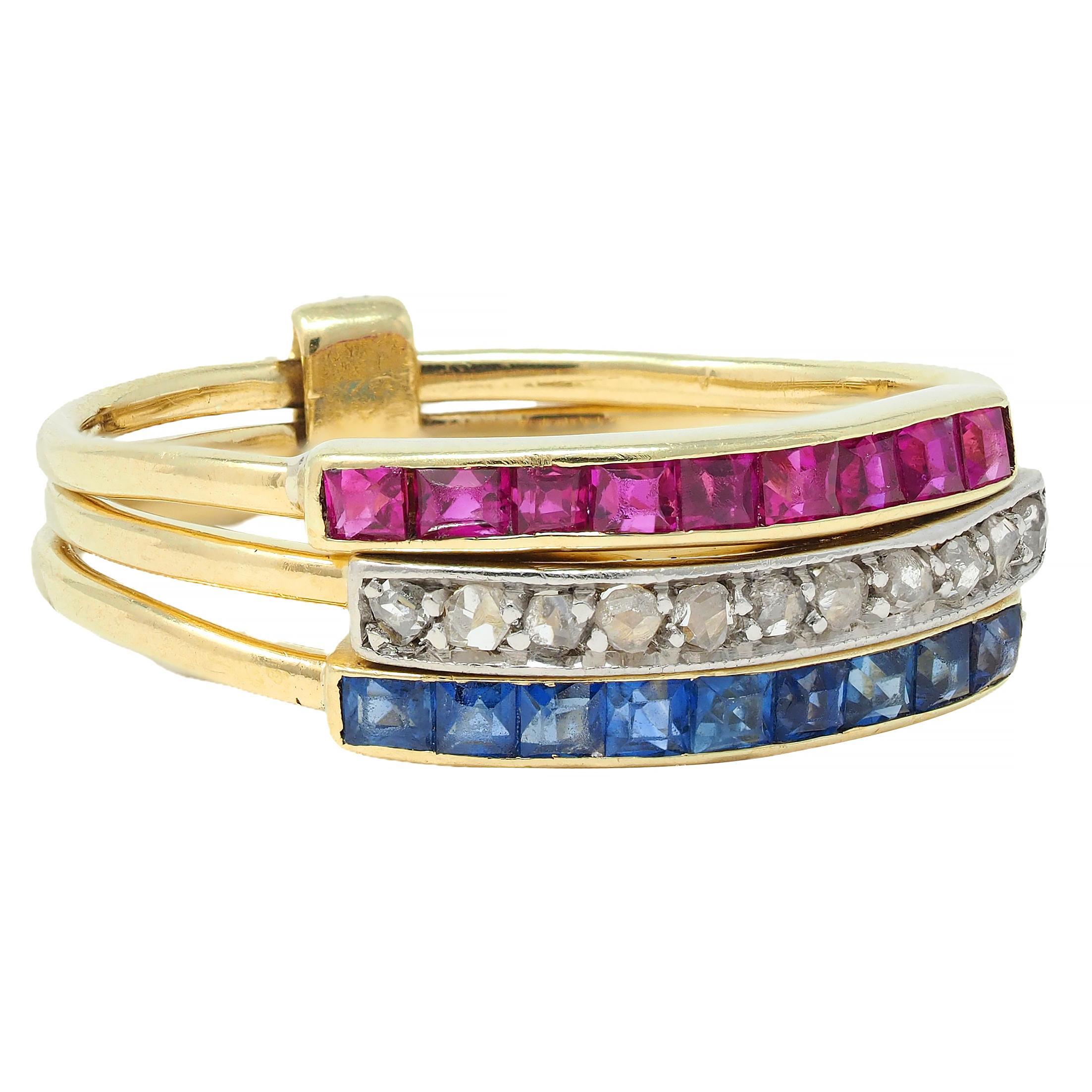 Comprised of three joined bands stacked with square step cut sapphires and rubies and rose cut diamonds 
Sapphires weigh approximately 0.27 carat total - transparent medium blue and channel set
Rubies weigh approximately 0.27 carat total -