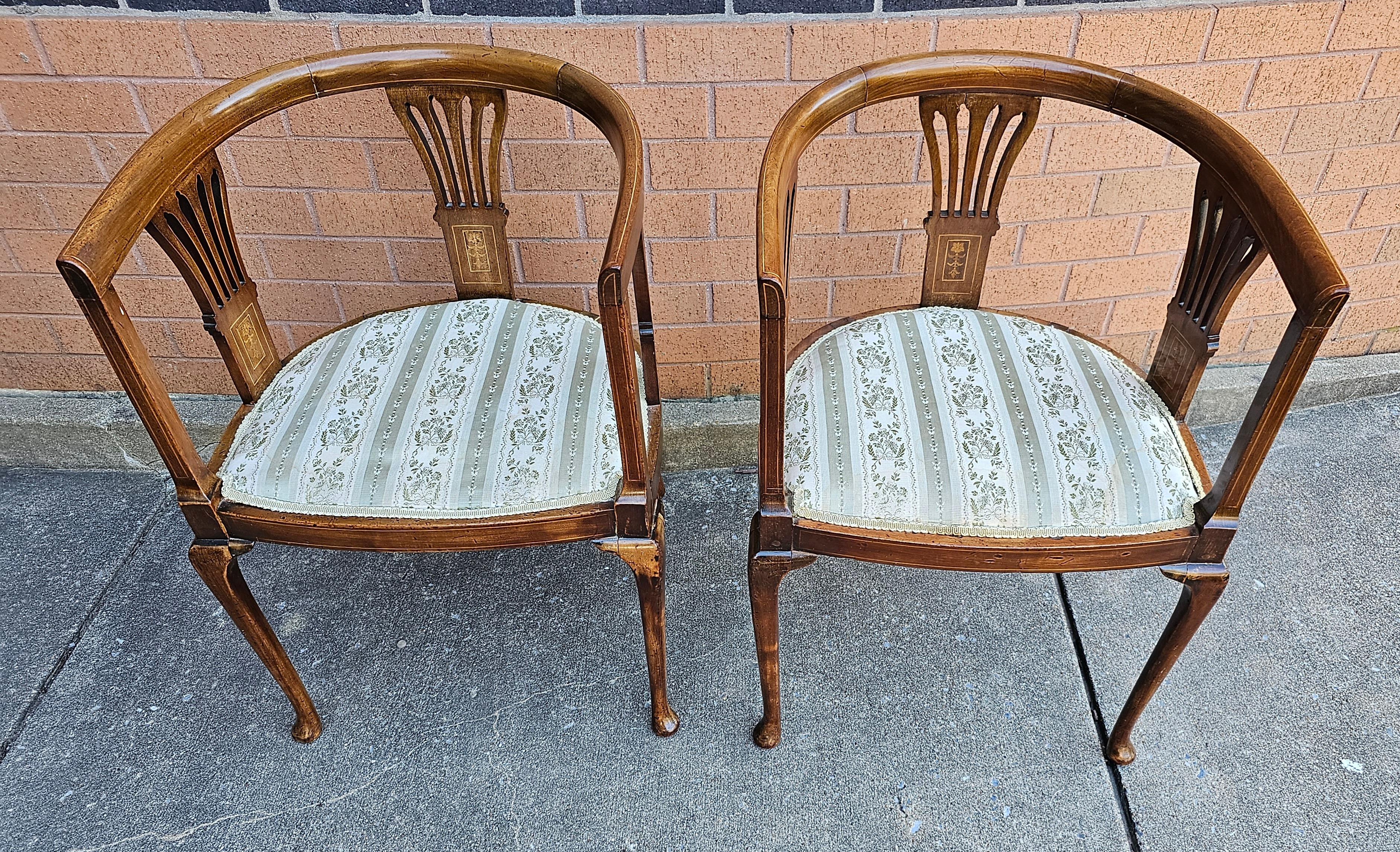 Exquisite Pair of  Edwardian Satinwood Inlaid Mahogany Barrel-Back Upholstered Club chairs with great patina. 
Very fine satinwood flower inlays on back sleighs and frame. Measures 21