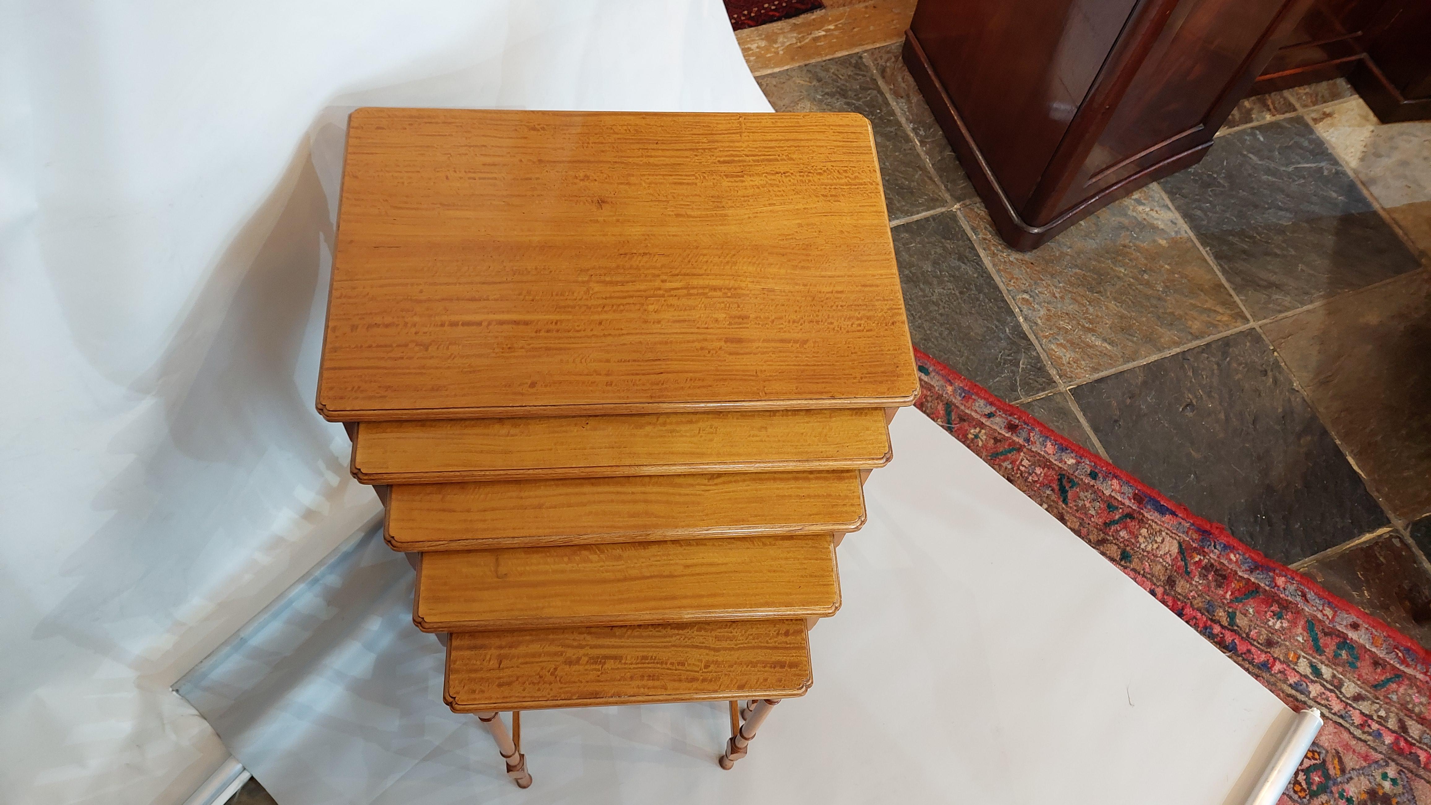 Edwardian Satinwood Quintetto Nest of Five Tables - the nest of 5 having Sheraton style turned legs supporting shaped moulded tops - 22