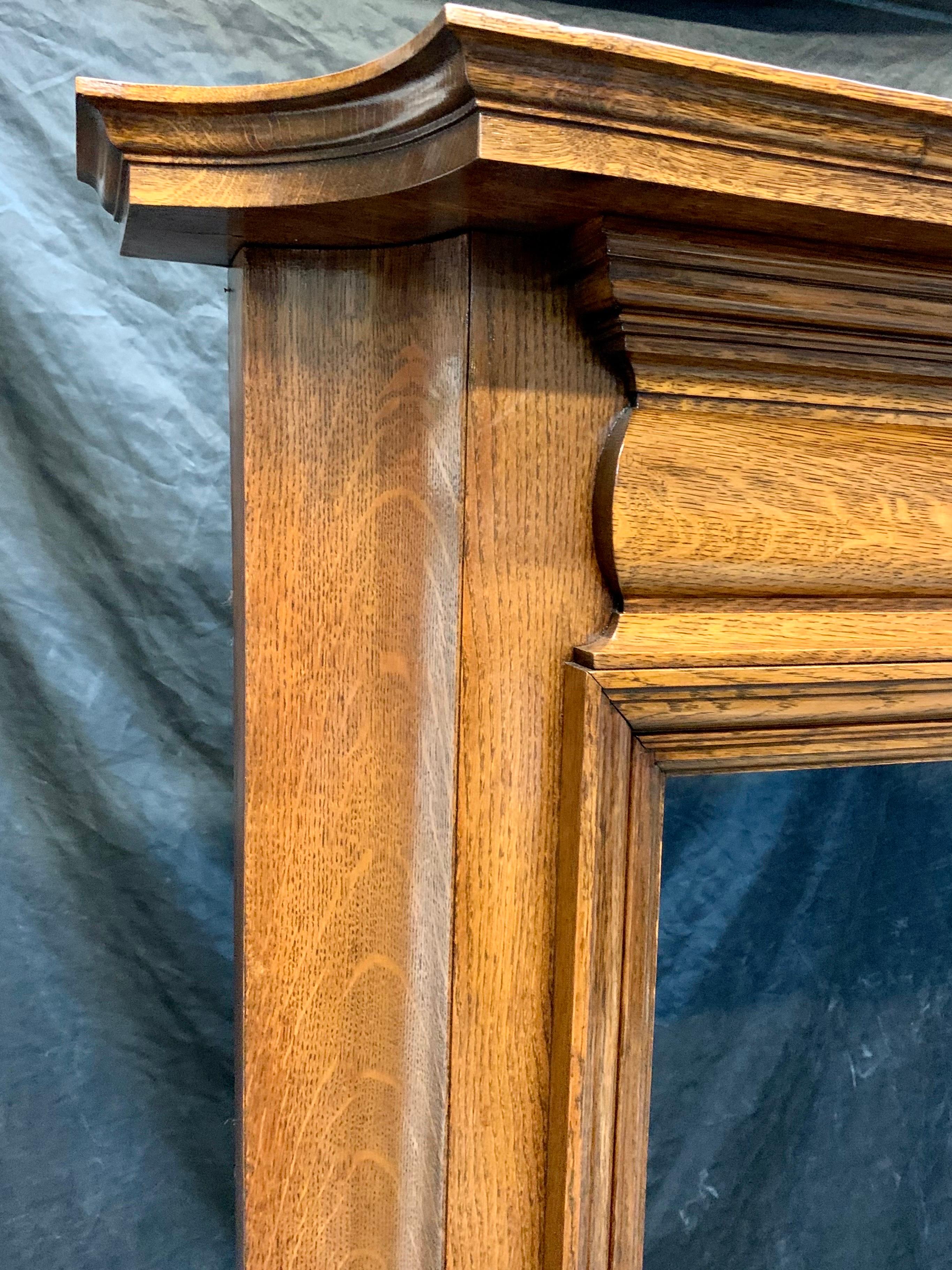 Appliqué Edwardian Scottish Oak Fireplace Surround.