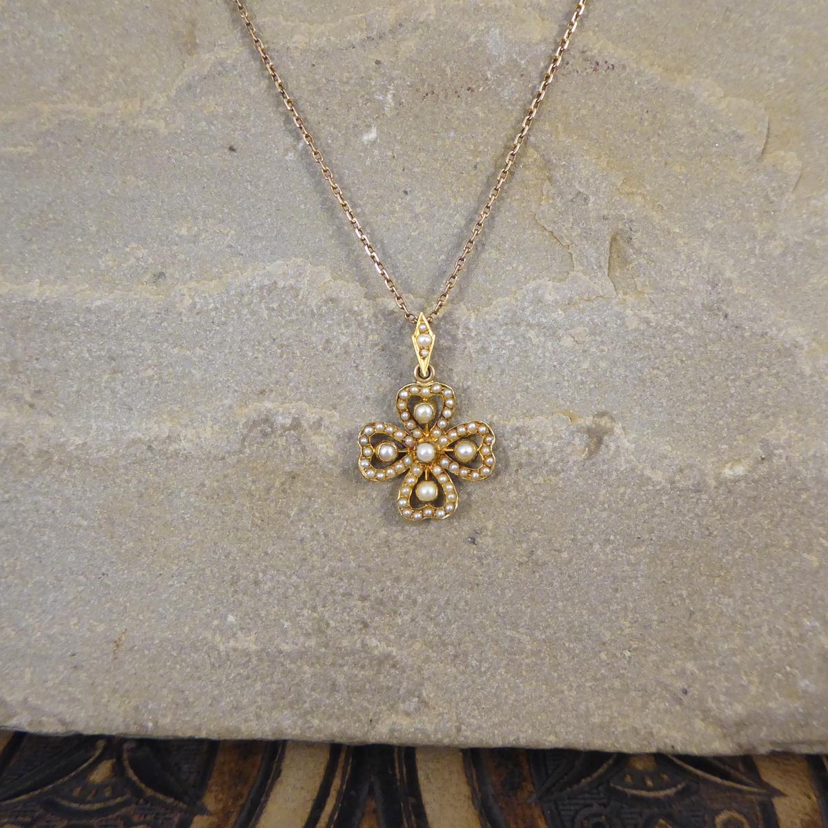 This gorgeous little necklace has been hand crafted in the Edwardian era with love and quality. Sitting on a contemporary 9ct Yellow Gold chain is a flower shaped pendant featuring 7 Garnets in a 9ct Yellow Gold rub over setting. The perfect gift